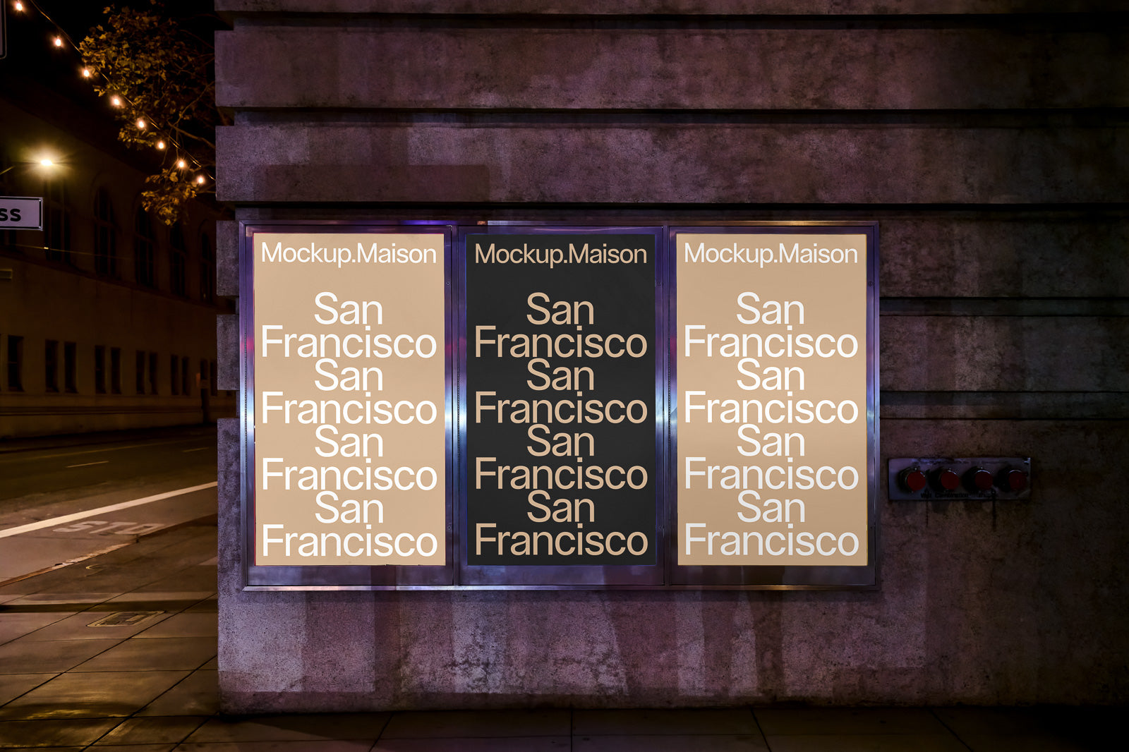 PSD mockup of three illuminated posters on a city street at night, displaying the text "San Francisco" in a repeated pattern with varying background colors.