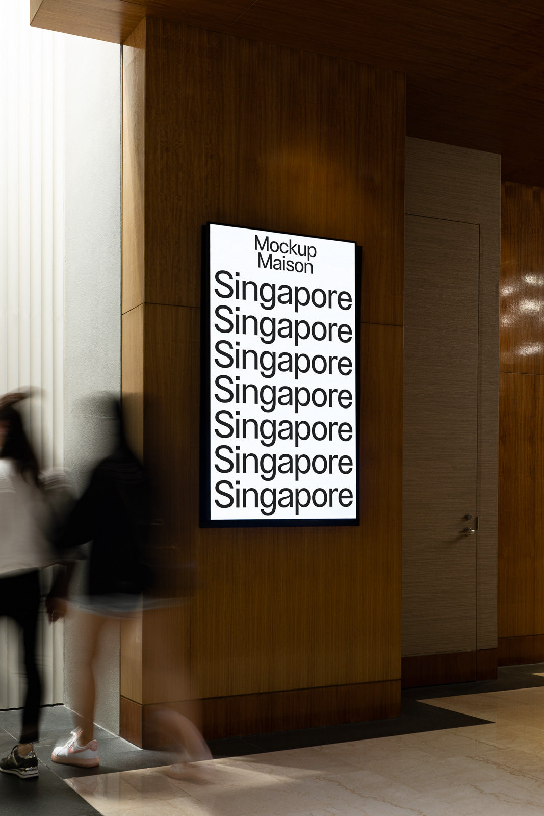 PSD mockup of a backlit poster with repeated text "Singapore" displayed on a wooden wall in a modern indoor setting, capturing passing motion of blurred figures.