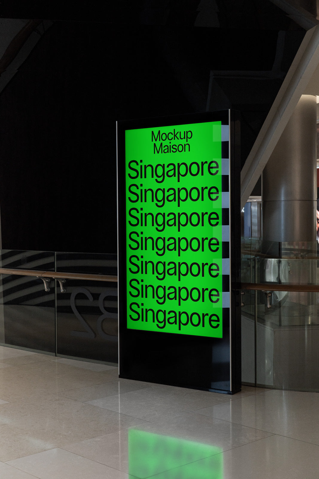 PSD mockup of an illuminated vertical display with green background and repeated text "Singapore" in a modern interior setting.