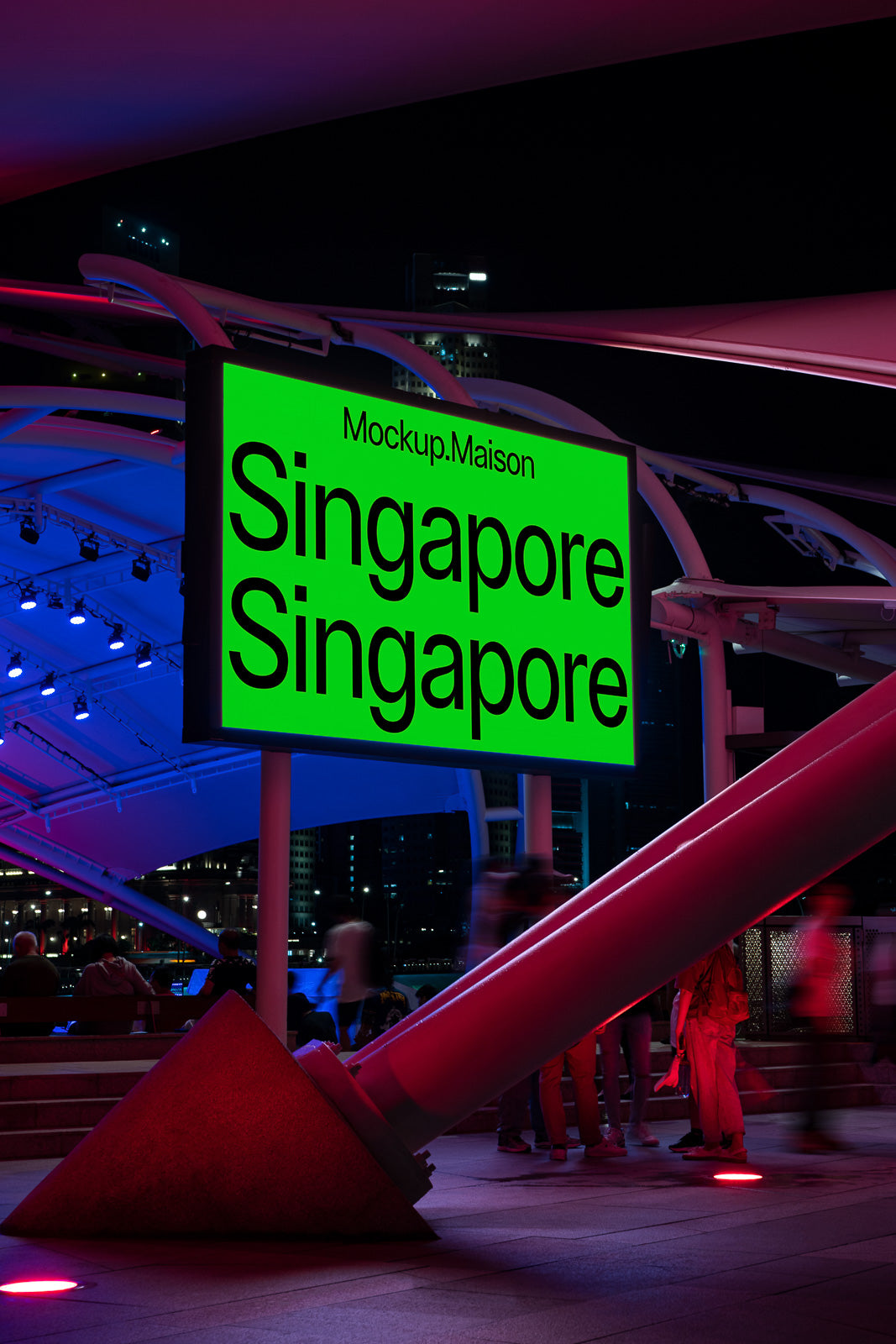 PSD mockup of an illuminated billboard in a vibrant urban setting at night, displaying the word "Singapore" twice in bold black text on a bright green background.