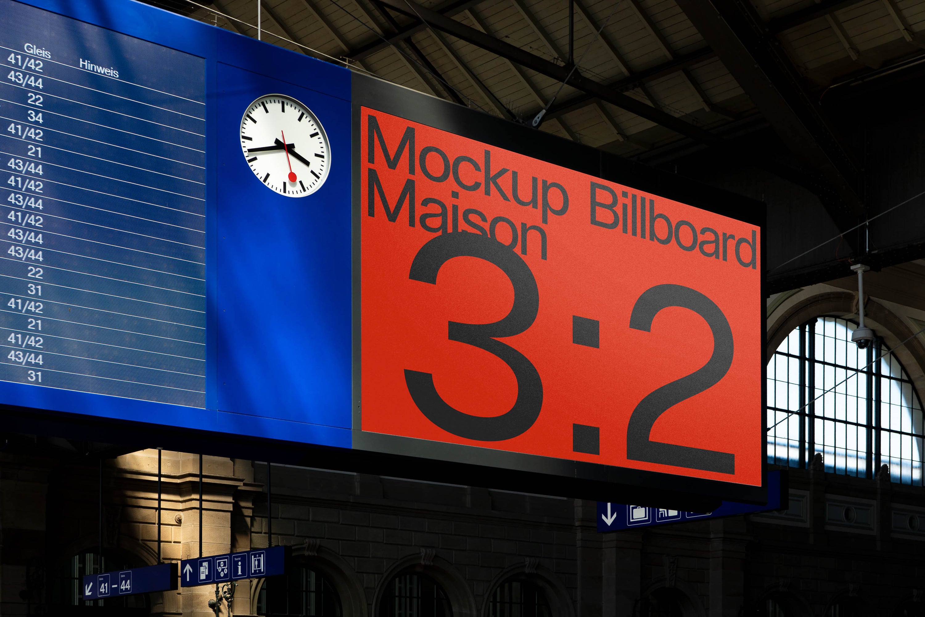 PSD mockup of a large red billboard displaying the text "Mockup Billboard Maison 3:2" in an indoor station setting with a departure board and clock nearby.