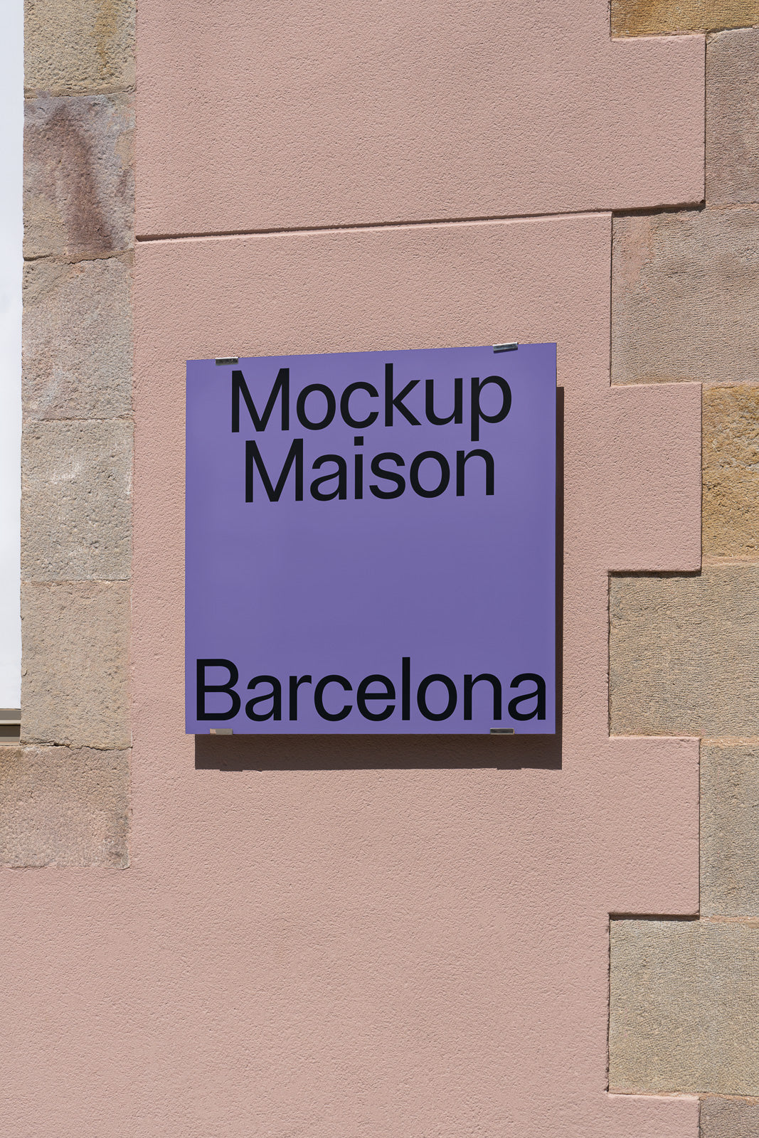 PSD mockup of a purple sign displaying text "Mockup Maison Barcelona" attached to a textured pink wall.
