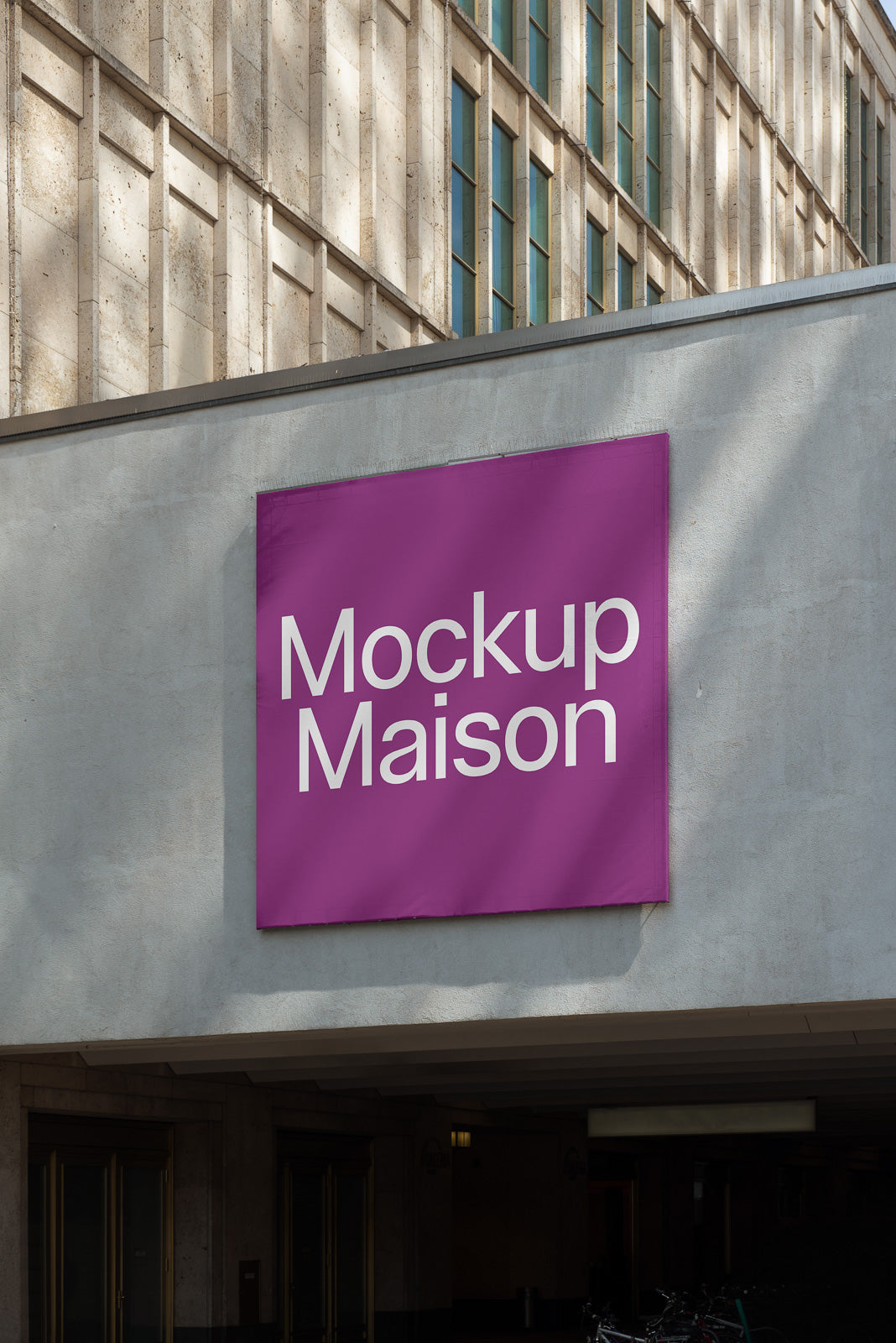 PSD mockup of a purple square sign on a building facade with the text "Mockup Maison" in white, framed by modern architecture features.