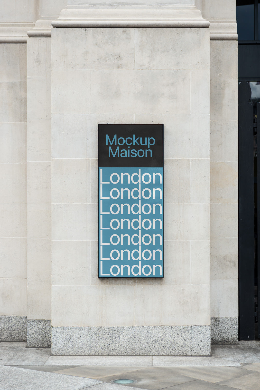 PSD mockup of a modern exterior wall sign with "Mockup Maison" and repeated "London" text, displayed on a stone building facade.