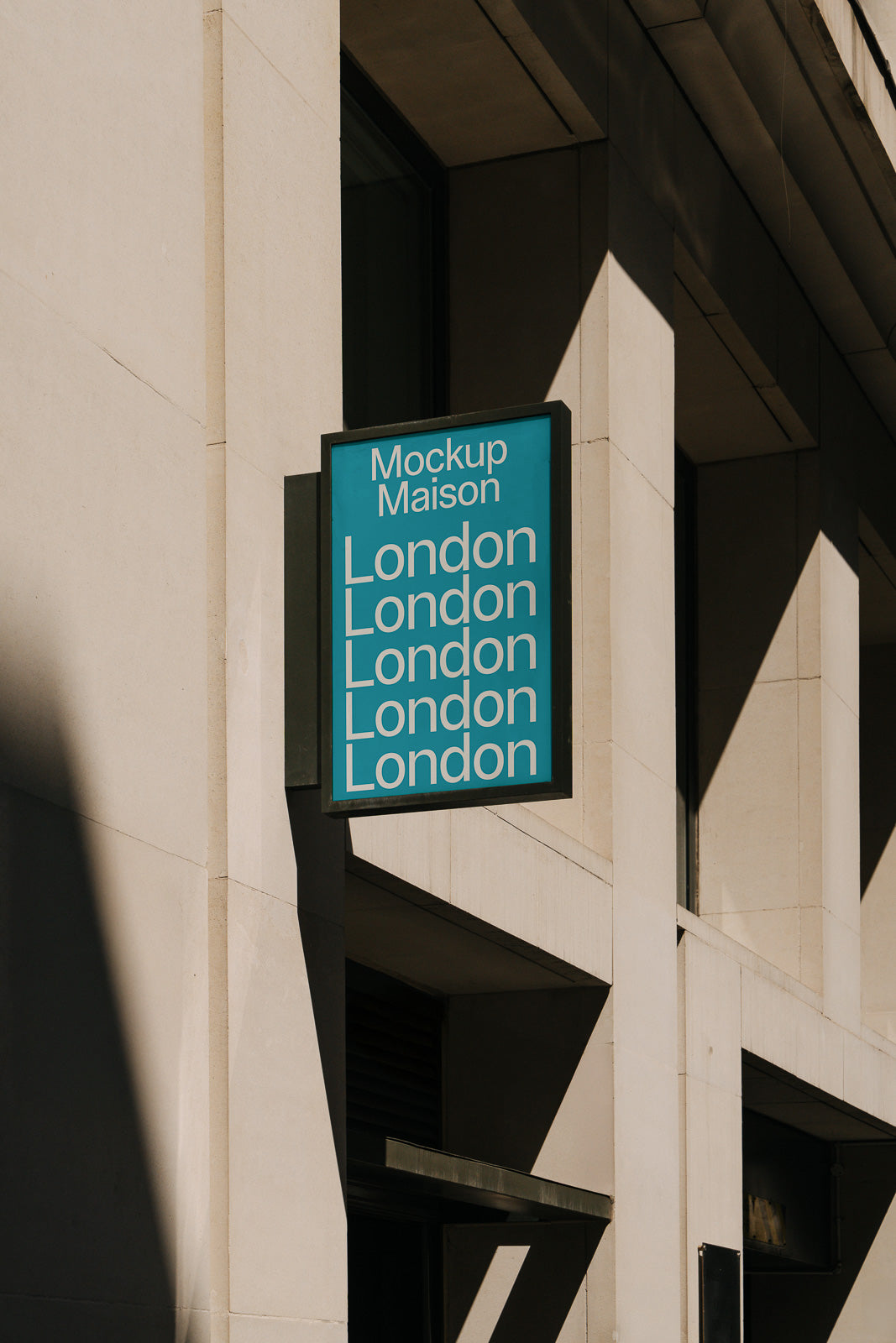 PSD mockup of a rectangular signage on a building exterior, displaying repeated text "London" against a light blue background, under a clear sky.