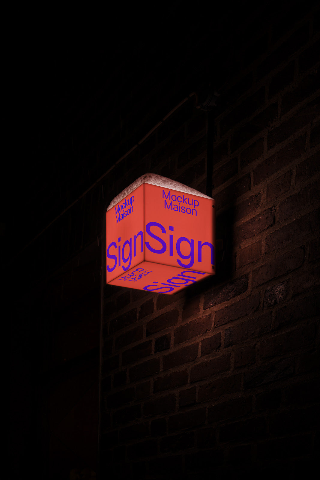 PSD mockup of a glowing cube sign attached to a brick wall at night, featuring the words "Mockup Maison" and "Sign" in bold typography.