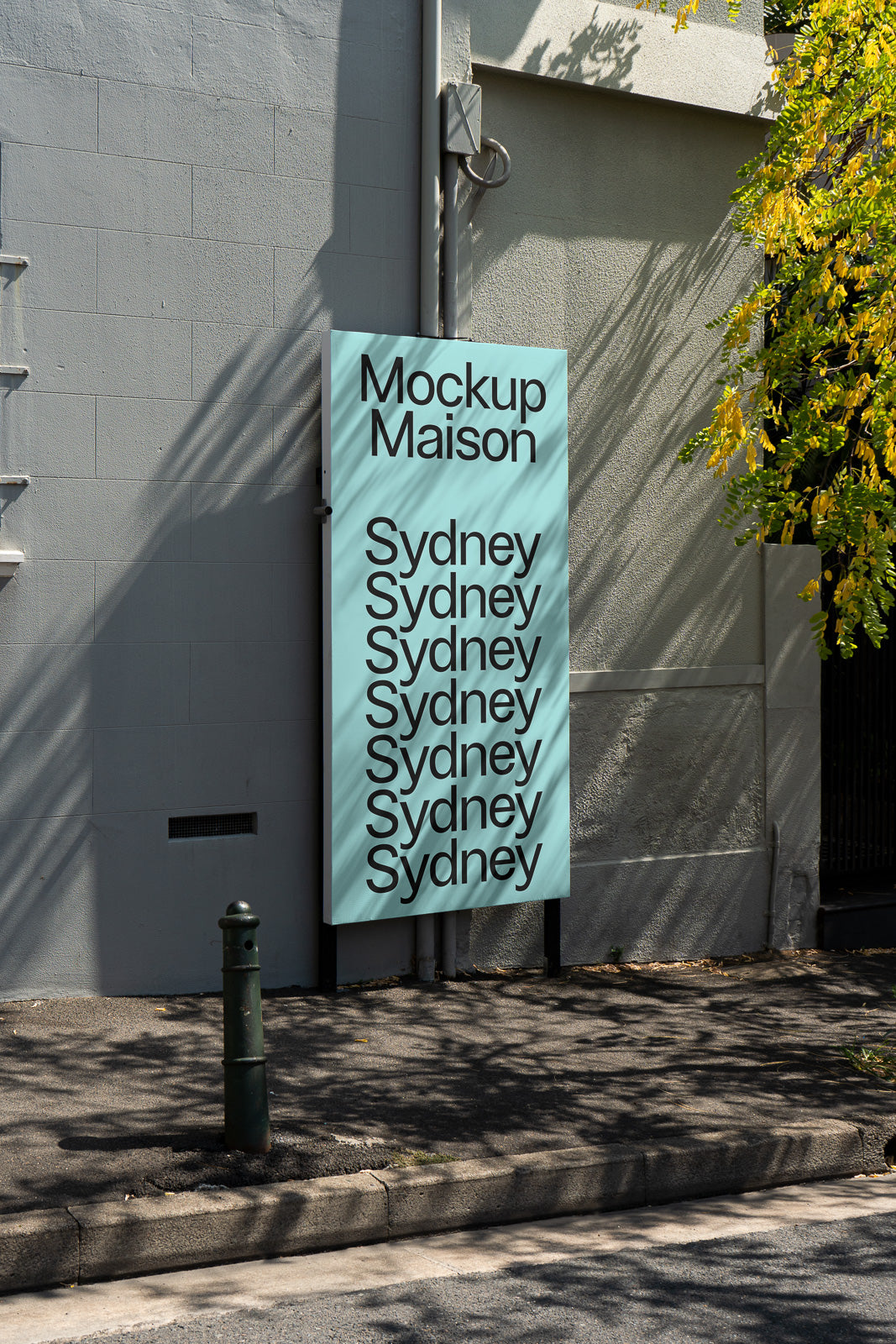 PSD mockup of a vertical sign on a building exterior with repeated text "Sydney" and "Mockup Maison" in a minimalist urban setting.