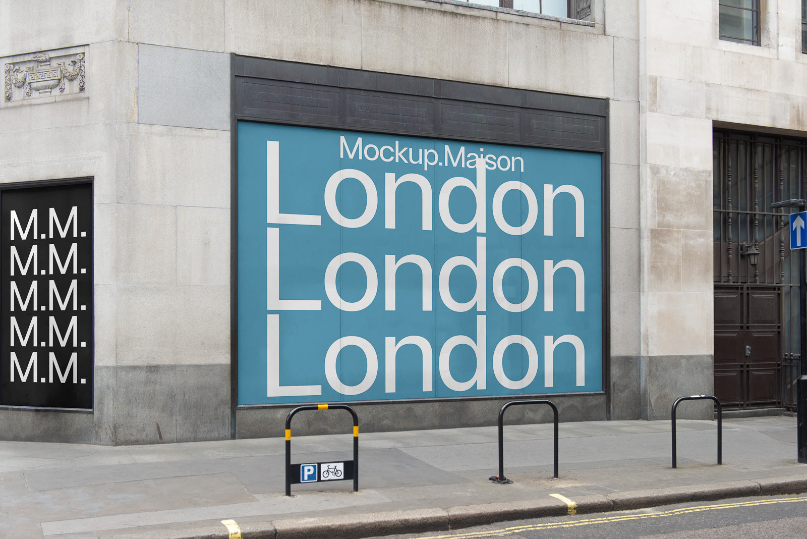 PSD mockup of an urban storefront with large "London" text on a blue background, featuring "M.M." design on adjacent wall, depicting a city street scene.