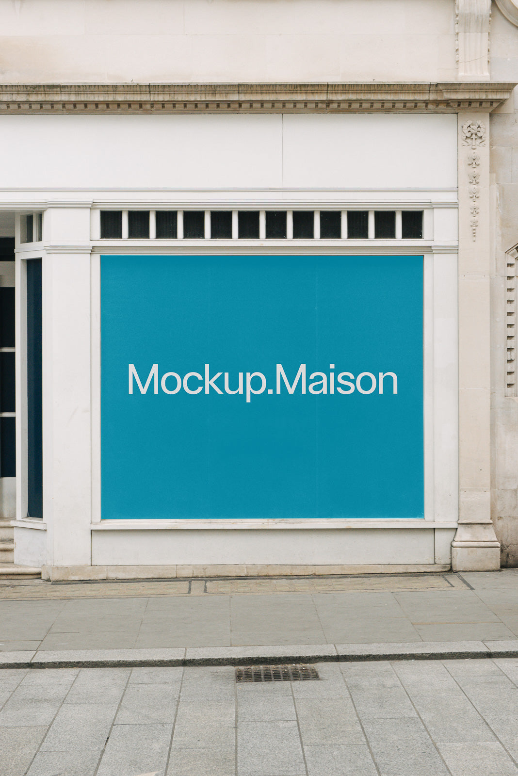 PSD mockup of a large blue poster displayed on the exterior wall of a building with the text "Mockup.Maison" visible, framed by a white border.