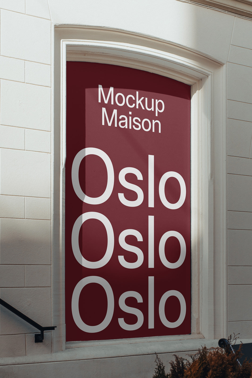 PSD mockup of a large burgundy sign in a white building's arched window, featuring the words "Mockup Maison" and "Oslo" repeated three times vertically.