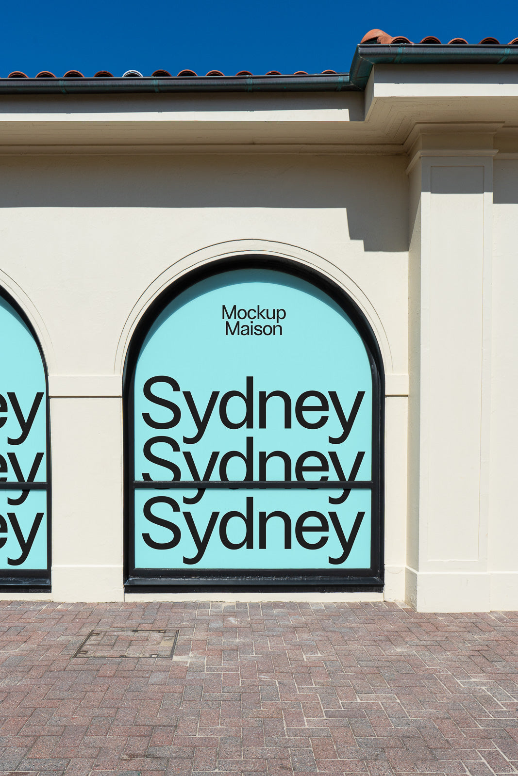 PSD mockup of an arched window display featuring the word "Sydney" repeated on a blue background with bold black text.