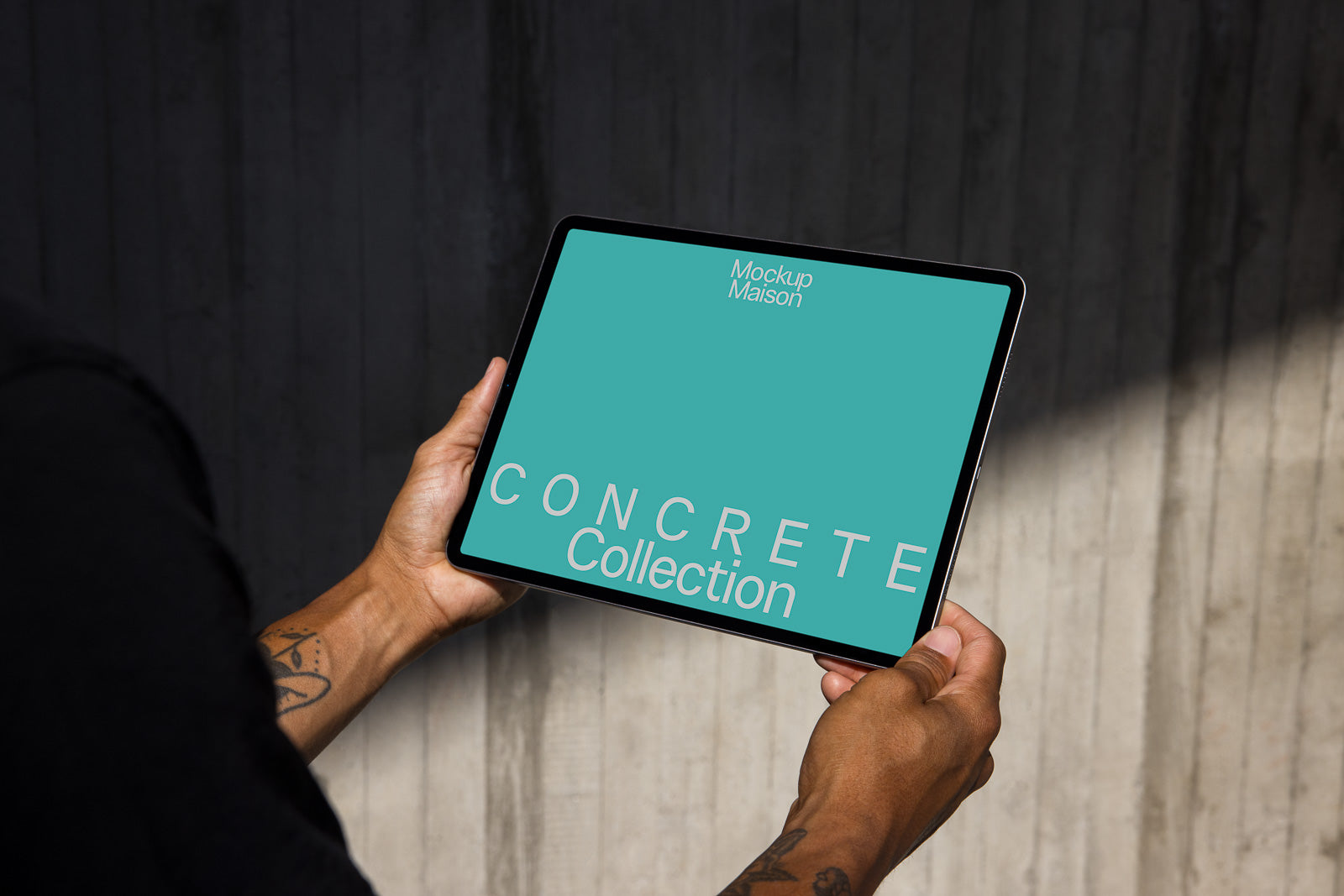 PSD mockup of a person holding a tablet displaying a design titled "Concrete Collection" on a teal background, set against a textured concrete wall.