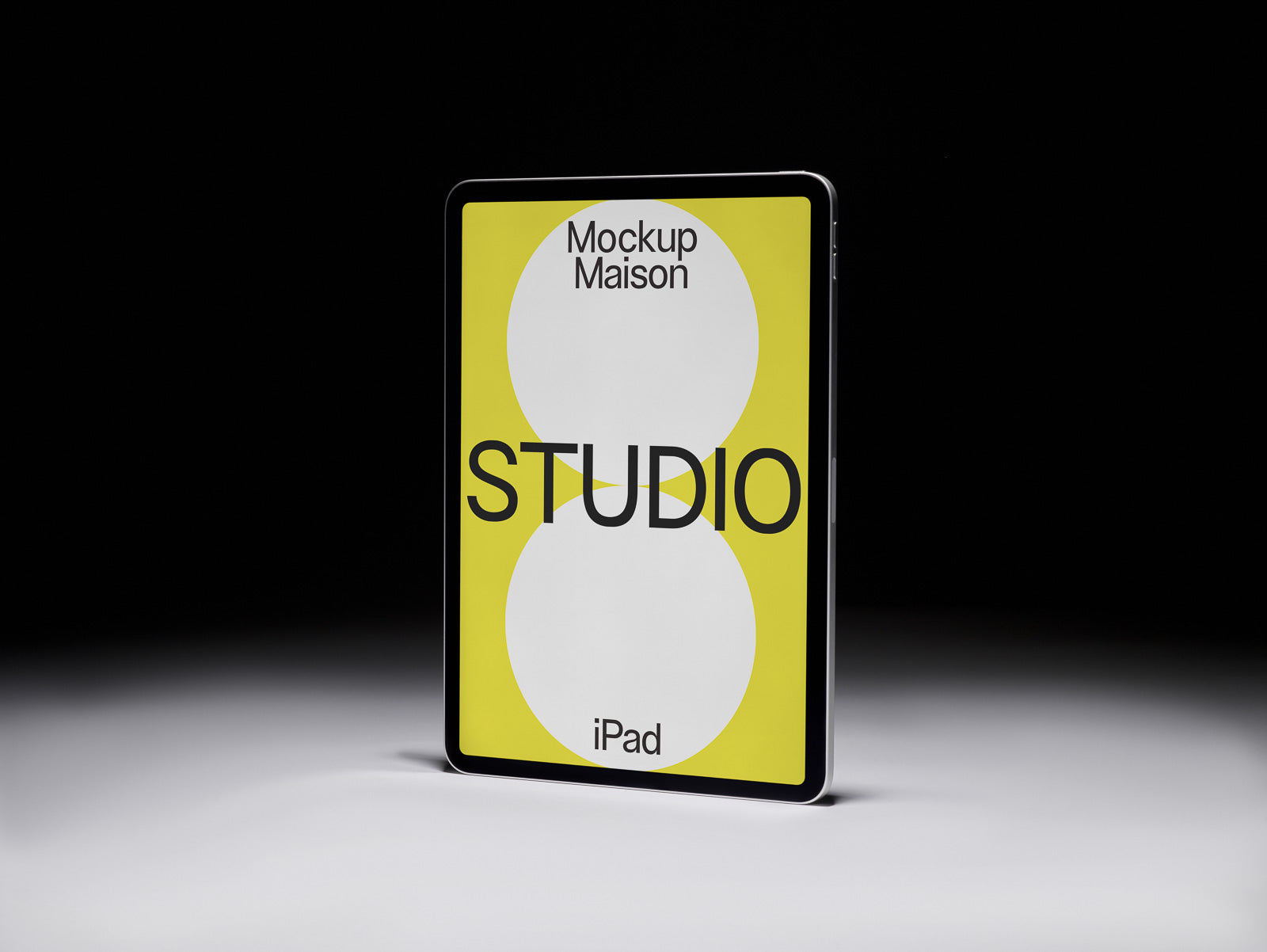 PSD mockup of a tablet displaying a design with bold text "STUDIO" on a yellow and white background, titled "Mockup Maison" and "iPad".