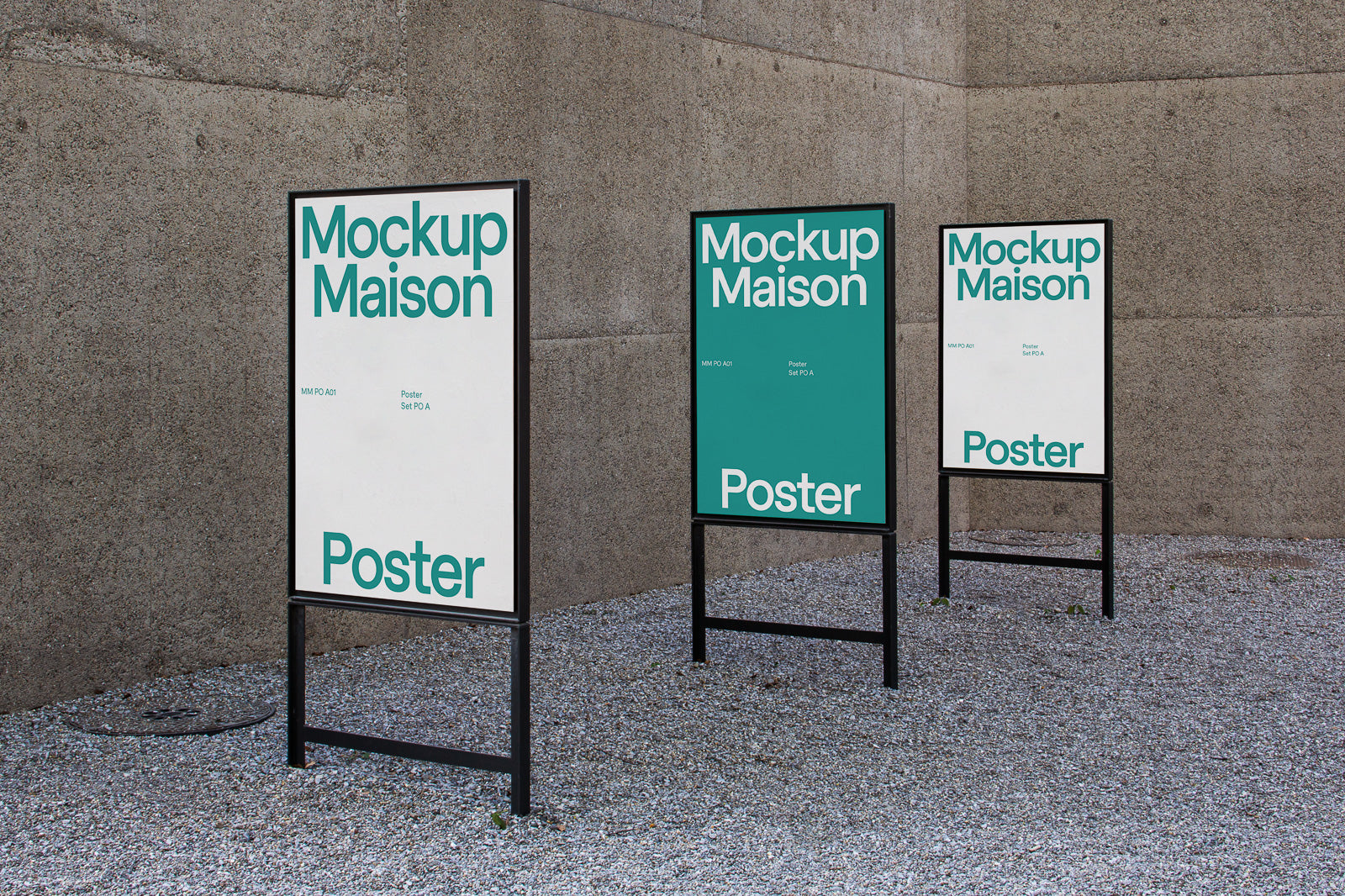 PSD mockup of three vertical poster frames on metal stands placed on a gravel surface against a textured concrete wall.