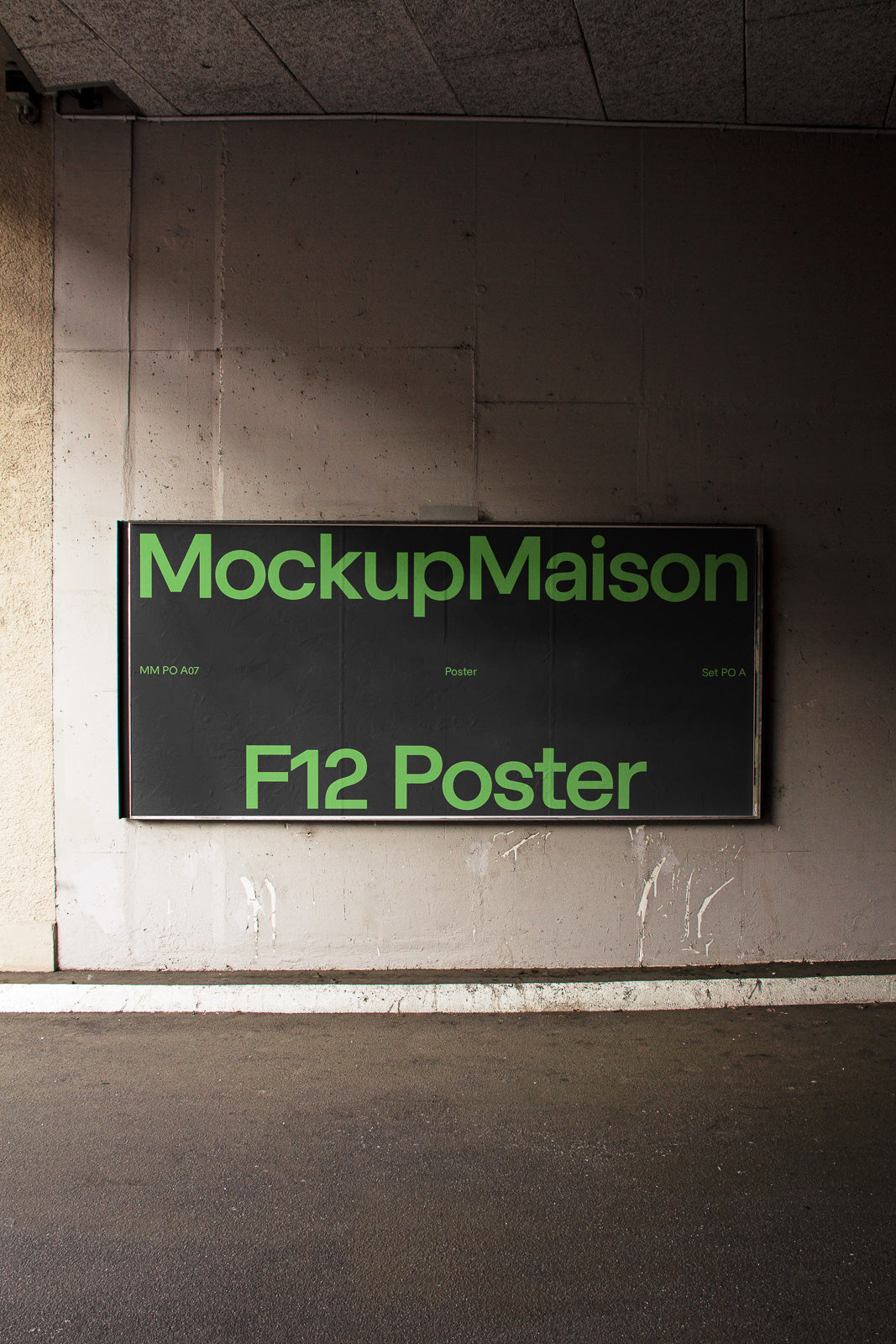 PSD mockup of a large poster displayed on an urban concrete wall, featuring bold green text on a dark background.