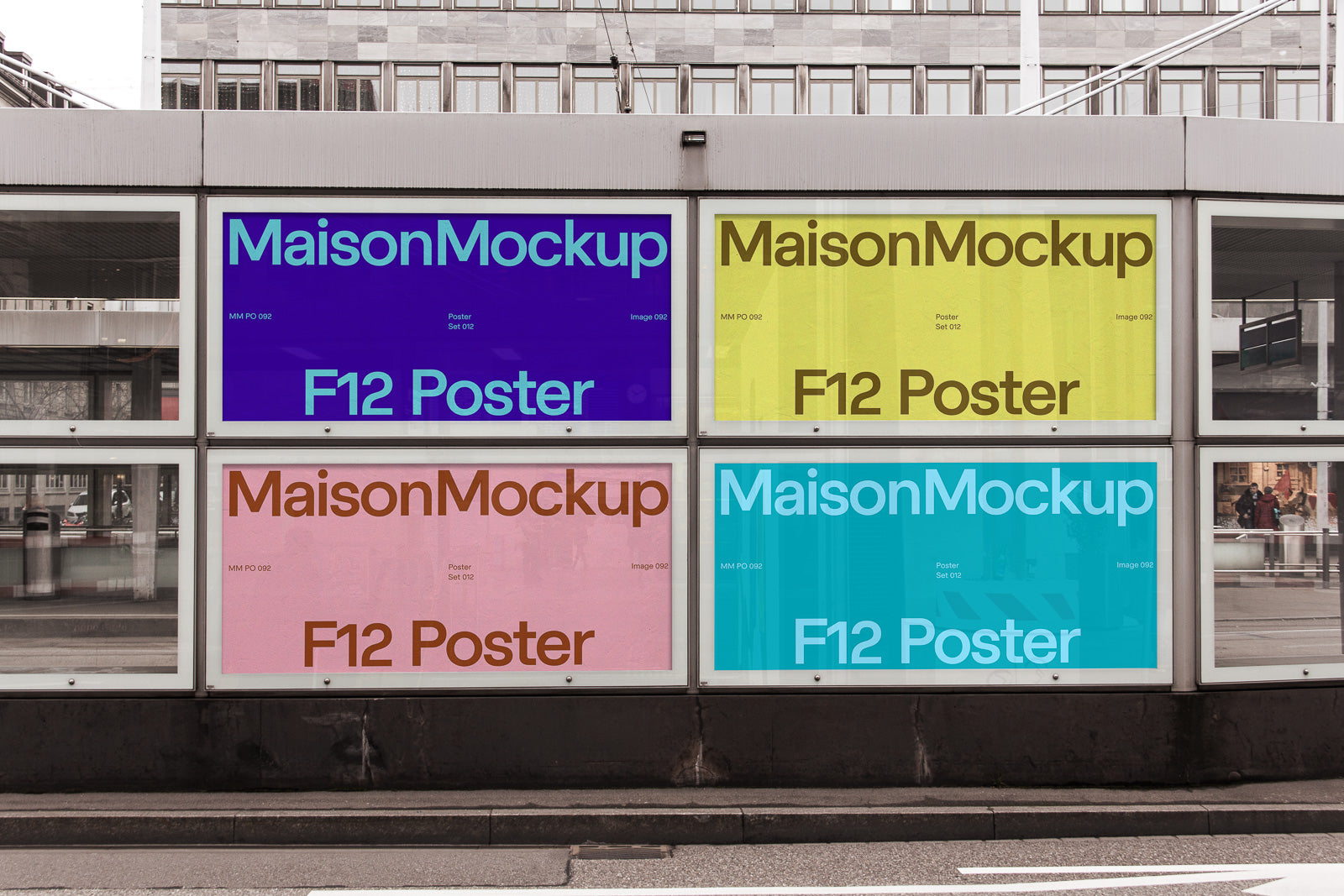PSD mockup of urban poster display showing four colorful panels in blue, yellow, pink, and light blue, each labeled "MaisonMockup F12 Poster."