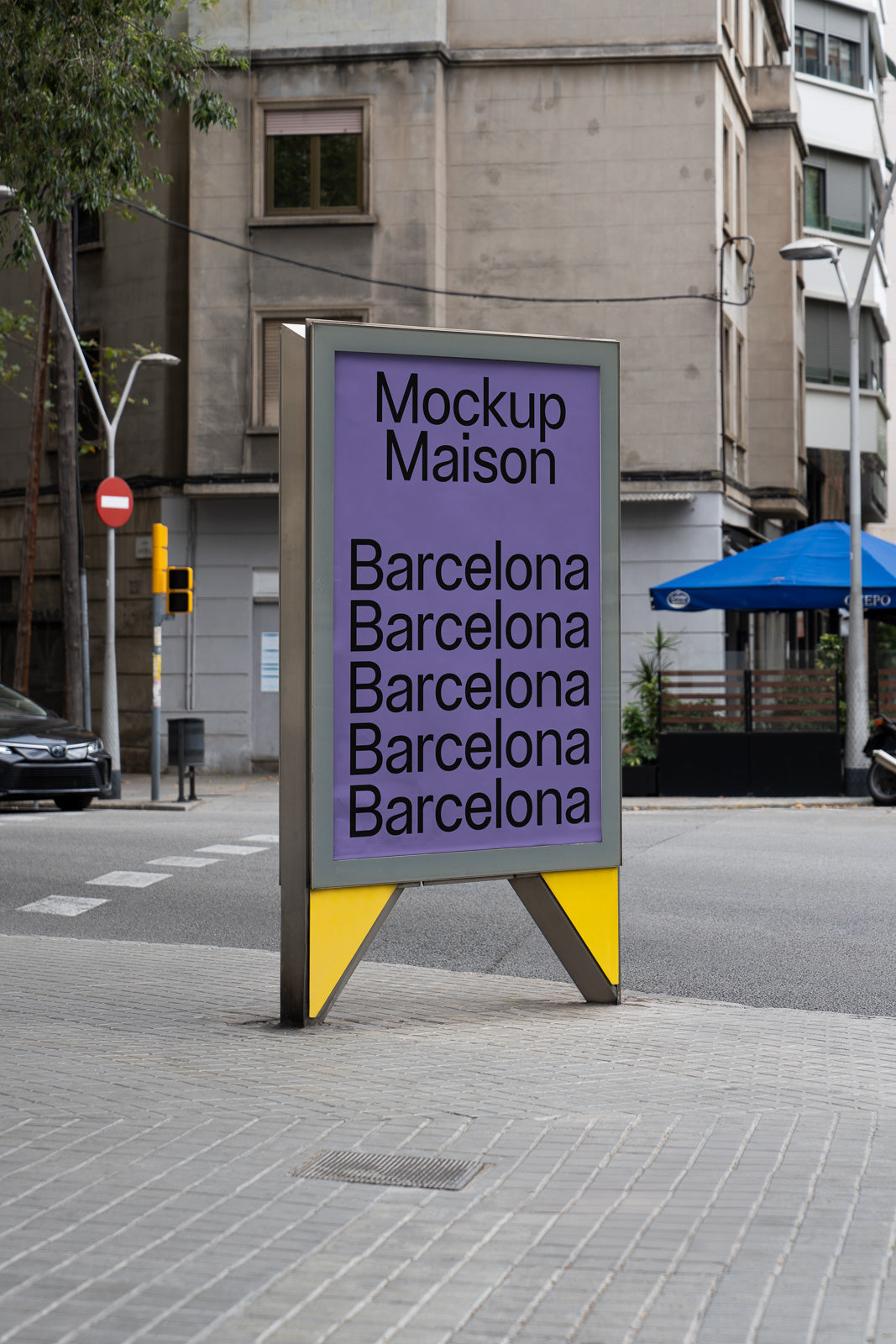 PSD mockup of an urban billboard displaying the text "Mockup Maison Barcelona" repeatedly, set against a city street background.