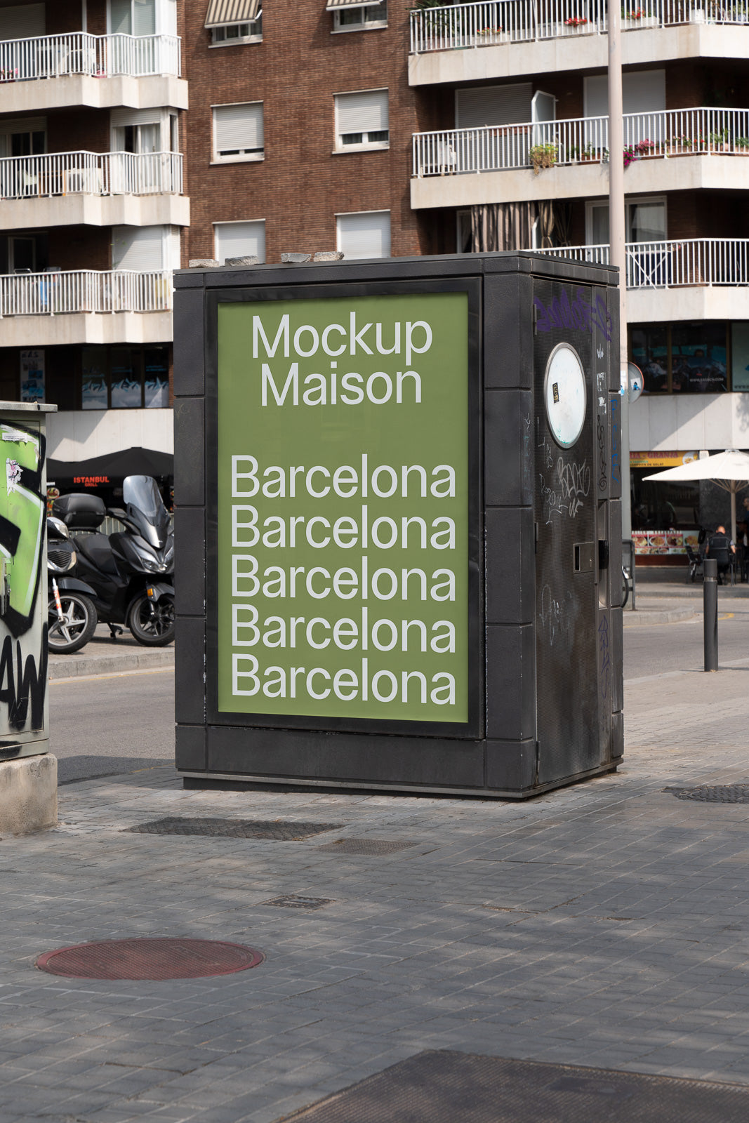 PSD mockup of a street advertisement display cabinet with text "Mockup Maison Barcelona" repeated multiple times, set in an urban environment.