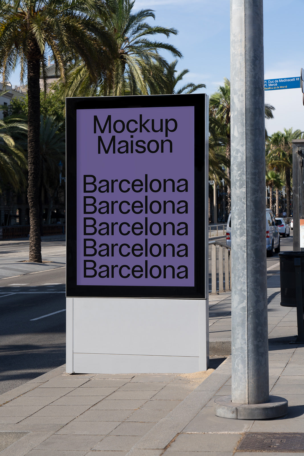 PSD mockup of an outdoor advertising display on a city street, featuring the text "Mockup Maison Barcelona" in a vertical layout.