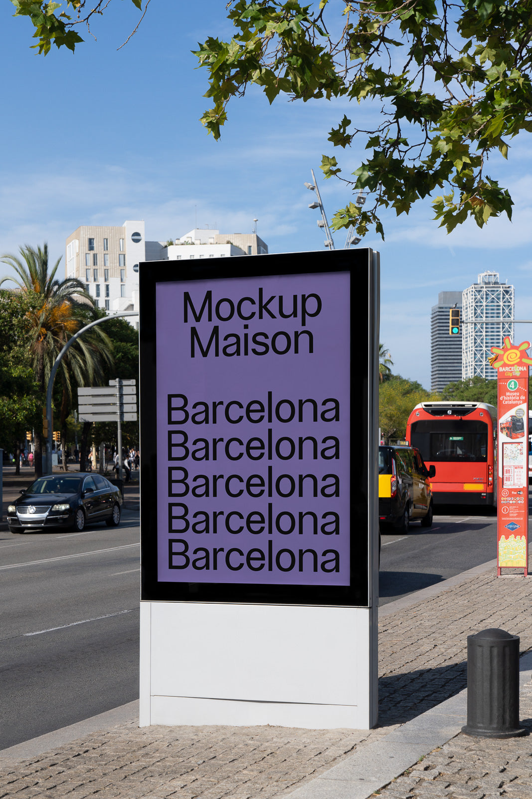 PSD mockup of a digital billboard on a city street, displaying text "Mockup Maison" and "Barcelona" repeatedly, with urban surroundings and traffic.