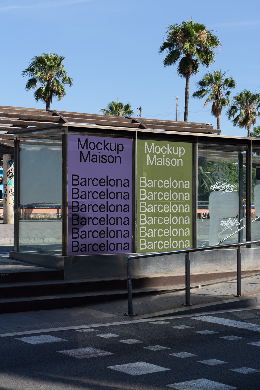 PSD mockup of a modern bus stop with large posters displayed on glass walls, featuring the text "Mockup Maison" and "Barcelona" against a backdrop of palm trees.