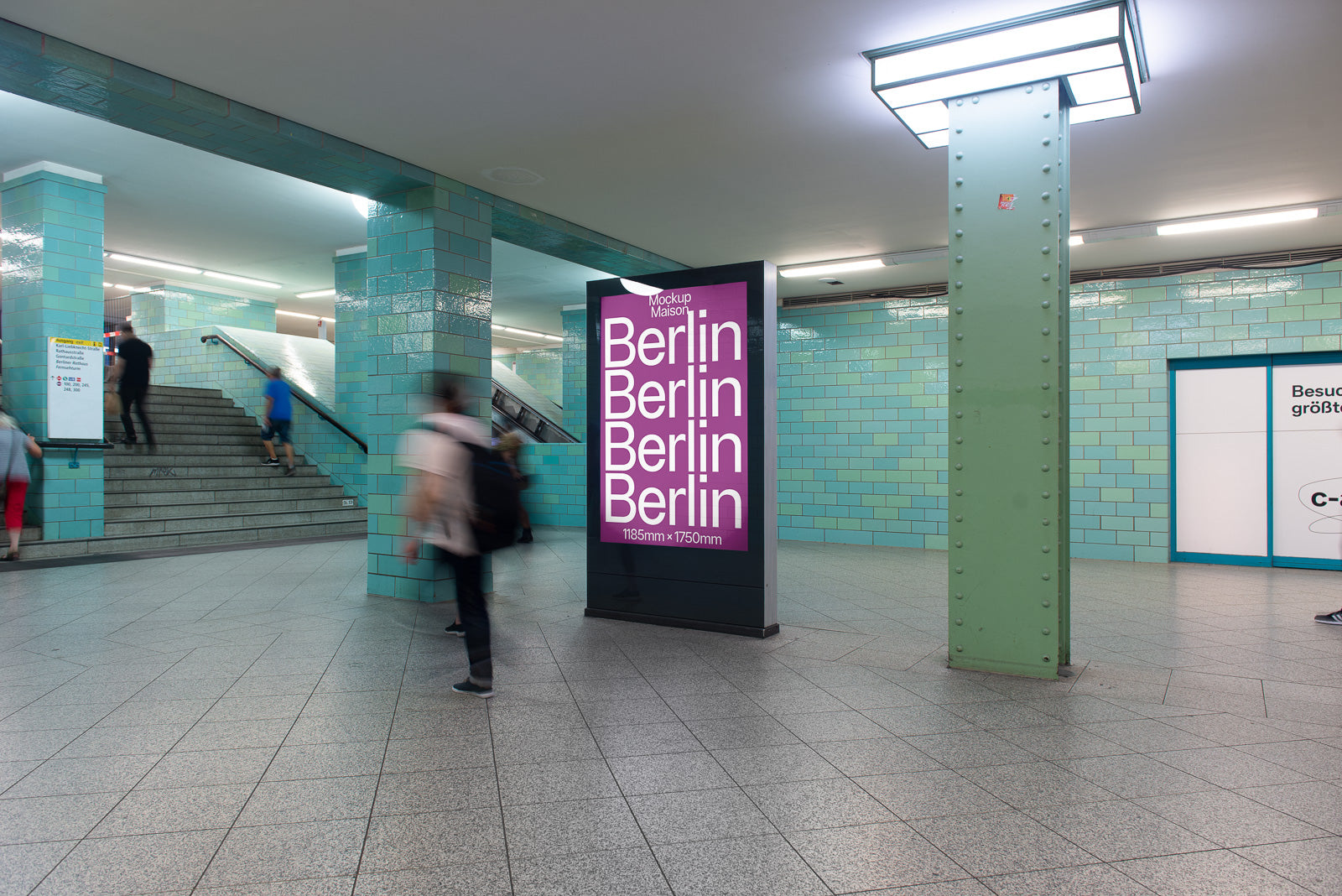 PSD mockup of a large digital billboard in a subway station, displaying the word "Berlin" repeatedly in bold white text on a bright magenta background.