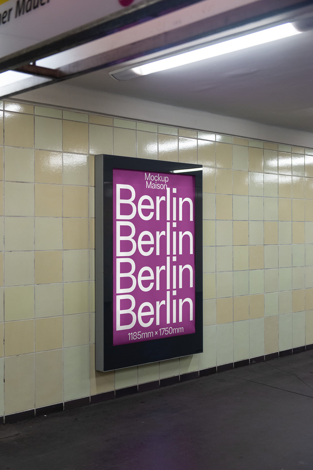 PSD mockup of a subway poster display in a tiled station, featuring the word "Berlin" repeatedly in large white font on a purple background.