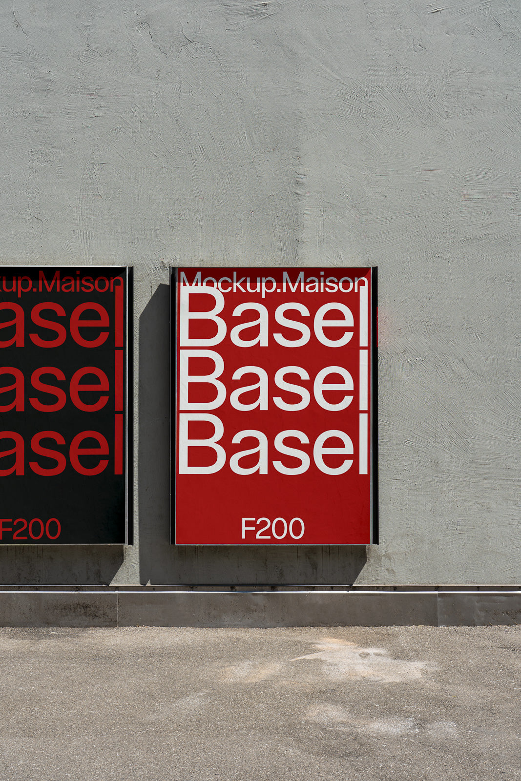 PSD mockup of two posters on a textured concrete wall, with bold white text reading "Base Basel" on red and black backgrounds, labeled F200.