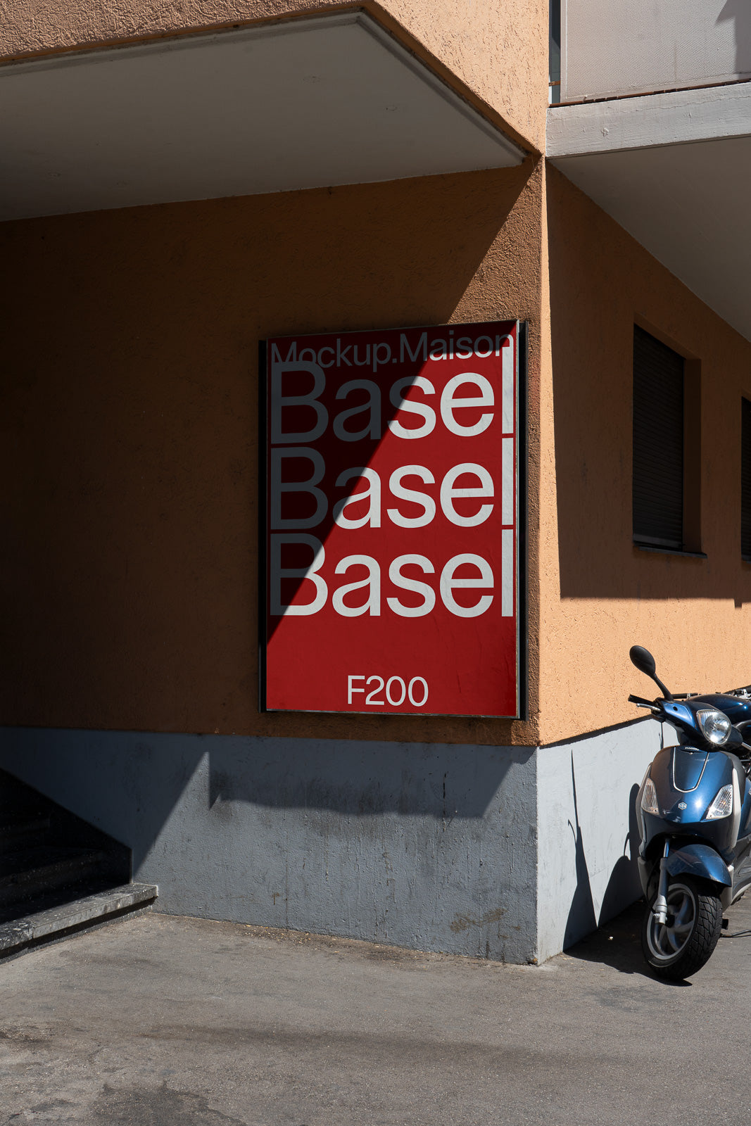 PSD mockup of a red outdoor poster on a building wall displaying large white text with the word "Base" repeated and a scooter parked nearby.