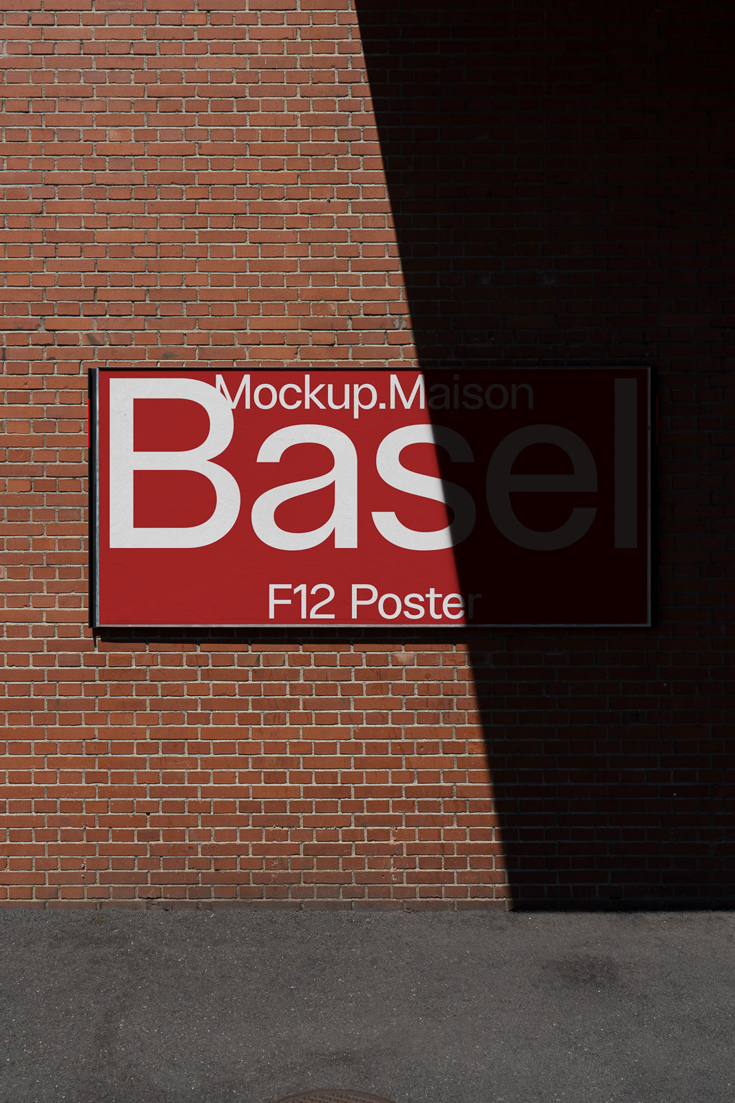 PSD mockup of a red Basel poster on a brick wall, with partially shadowed text.