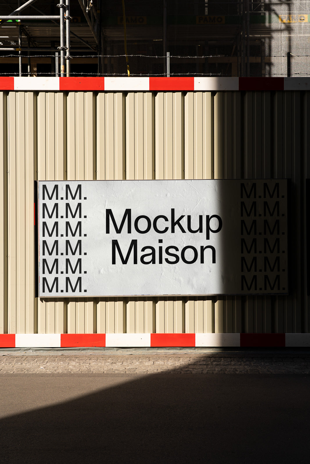 PSD mockup of a large outdoor sign displaying the text "Mockup Maison" on a corrugated metal wall, partially shadowed.