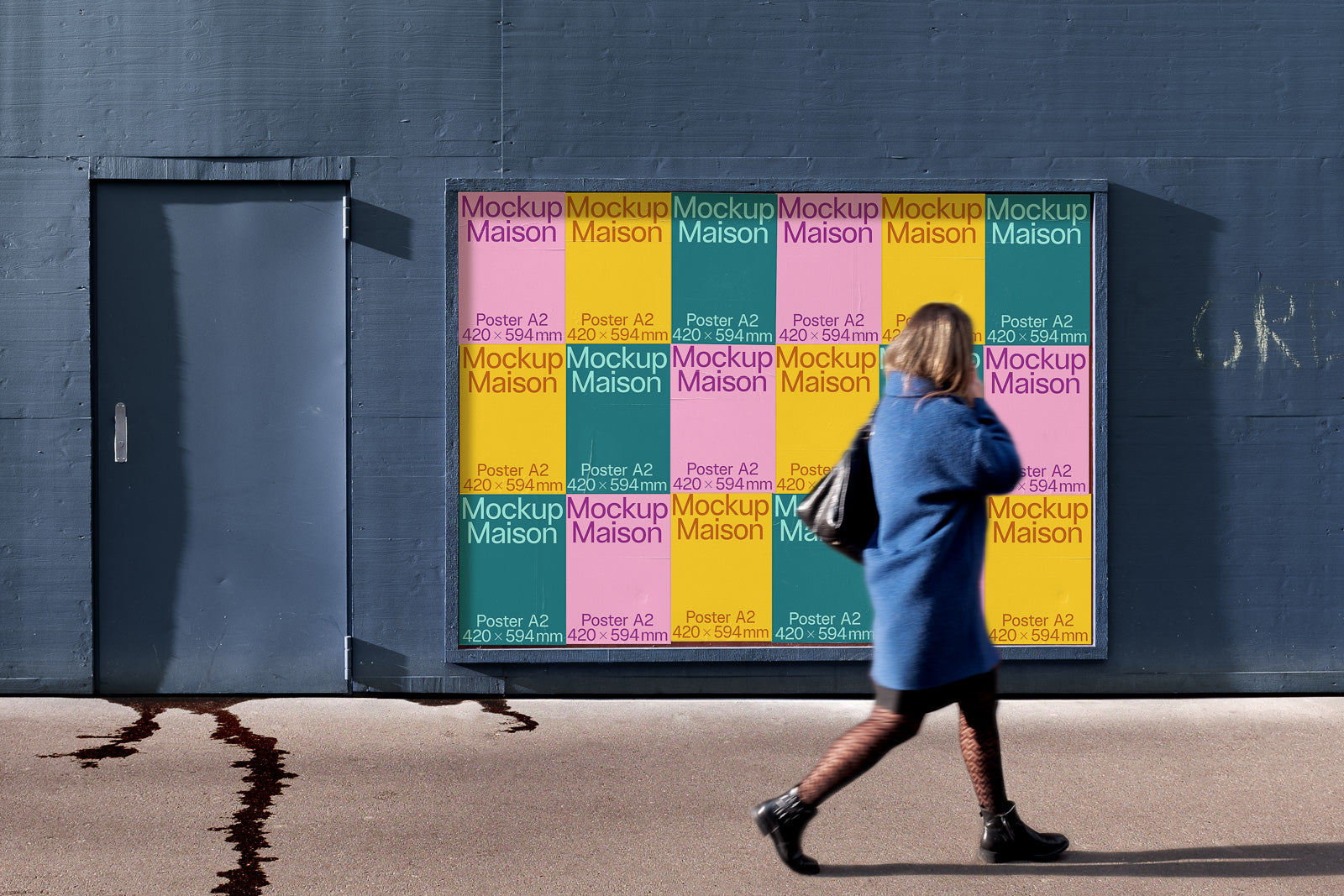 PSD mockup of colorful posters on a wall next to a closed door with a person in blue coat walking by.