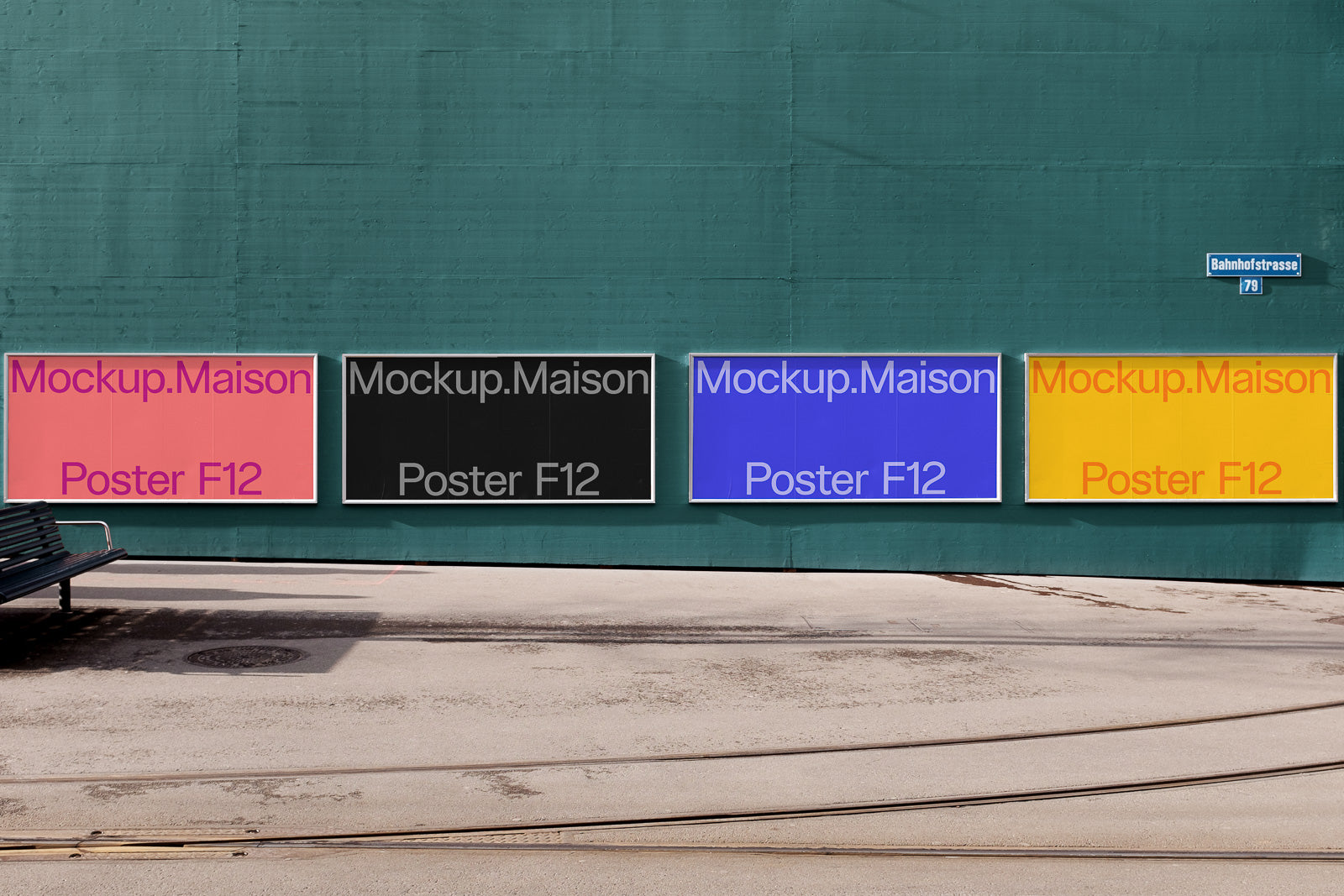 PSD mockup of four posters on a teal wall, each labeled "Mockup.Maison Poster F12" in different colors: pink, black, blue, and yellow.