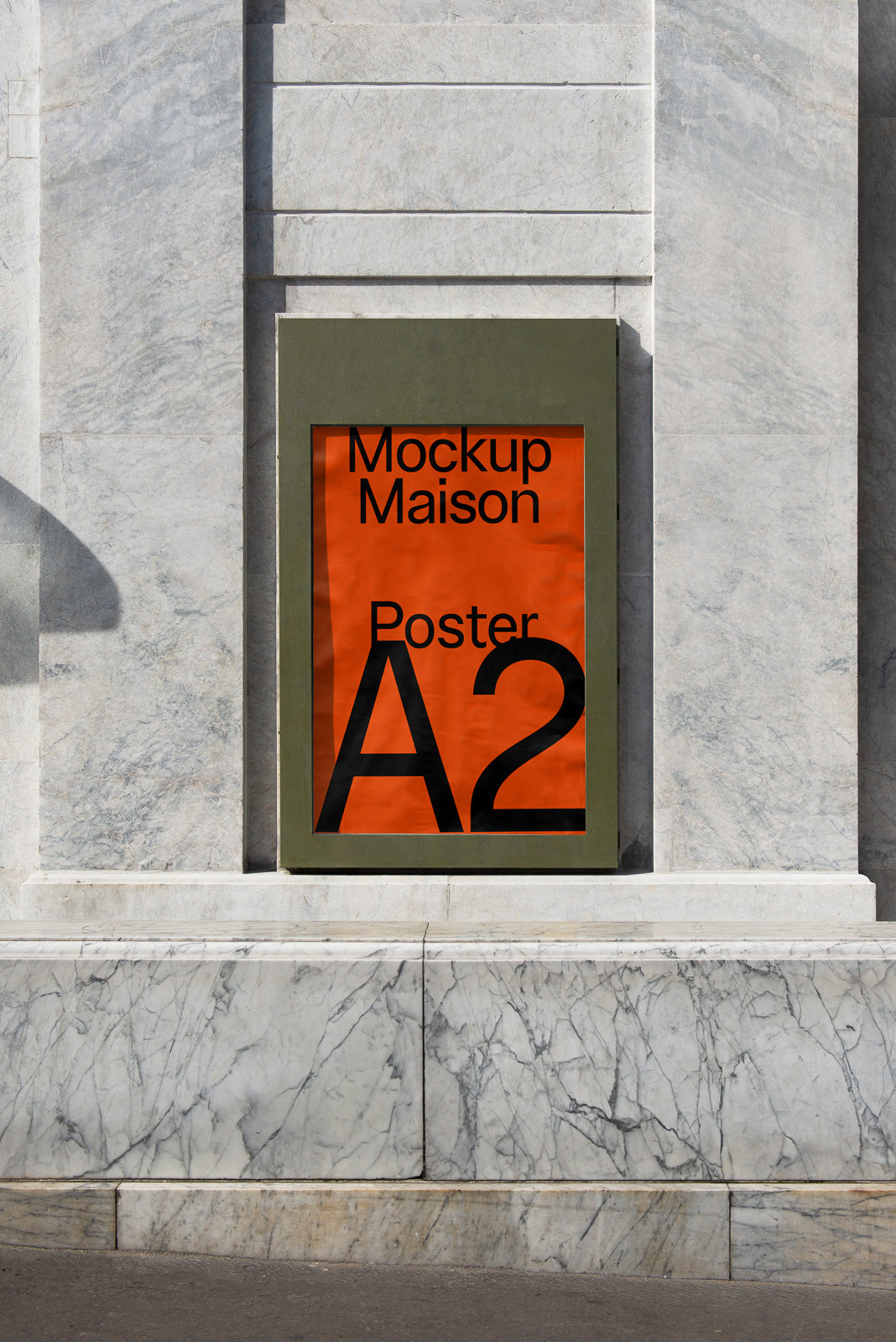 PSD mockup of an A2 poster displayed in a vertical frame on a marble wall, showcasing bold black text on an orange background.