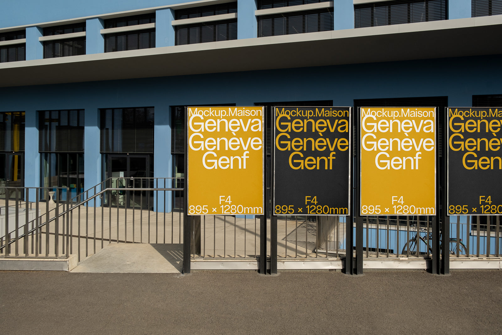 PSD mockup of outdoor posters in front of a modern building with windows and railings, displaying yellow and black backgrounds with typography and size details.
