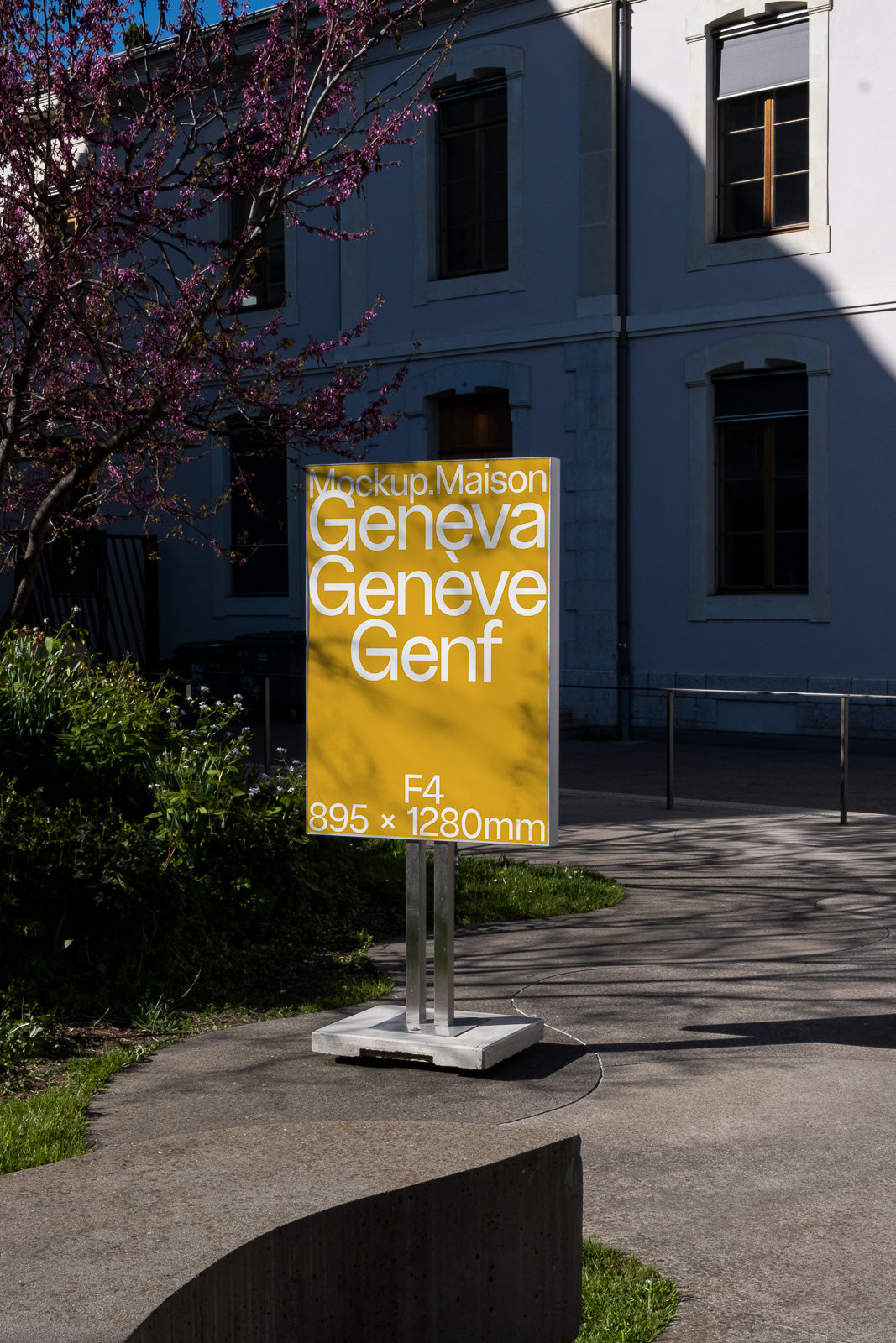 PSD mockup of a yellow poster stand in an outdoor setting, displaying text about Geneva in multiple languages, with dimensions 895 × 1280mm.
