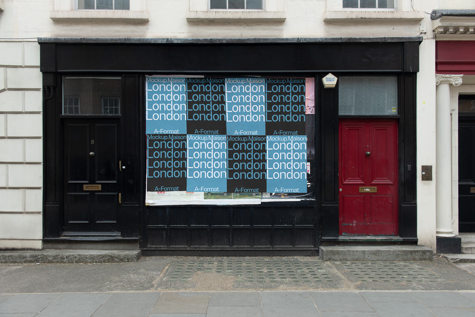 PSD mockup of a storefront window featuring posters with the word "London" and "A-Format Mockup.Maison" repeated, set between two doors, one black and one red.
