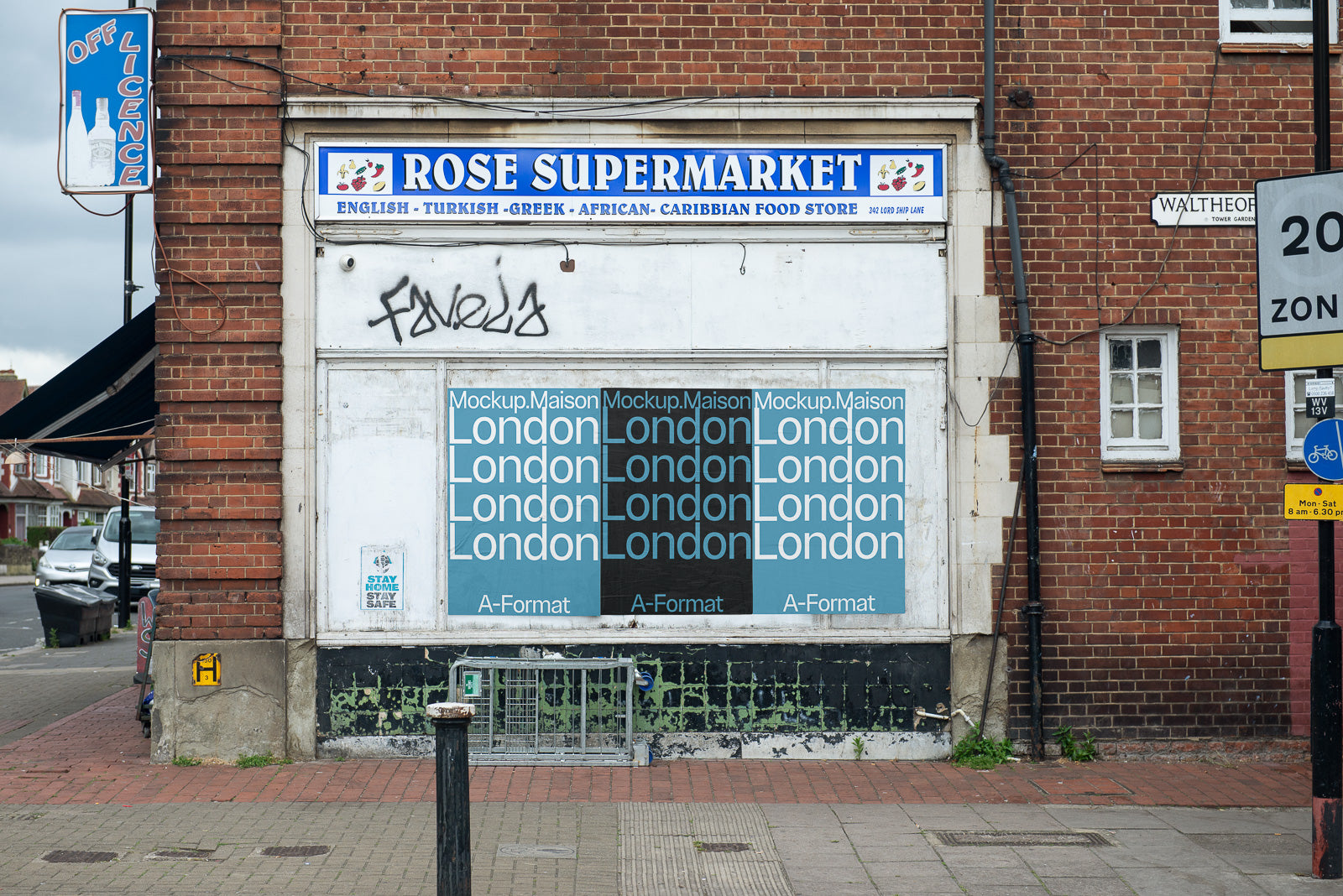 PSD mockup of a poster on the wall of a brick building, displaying the word "London" repeatedly in different colors and fonts.