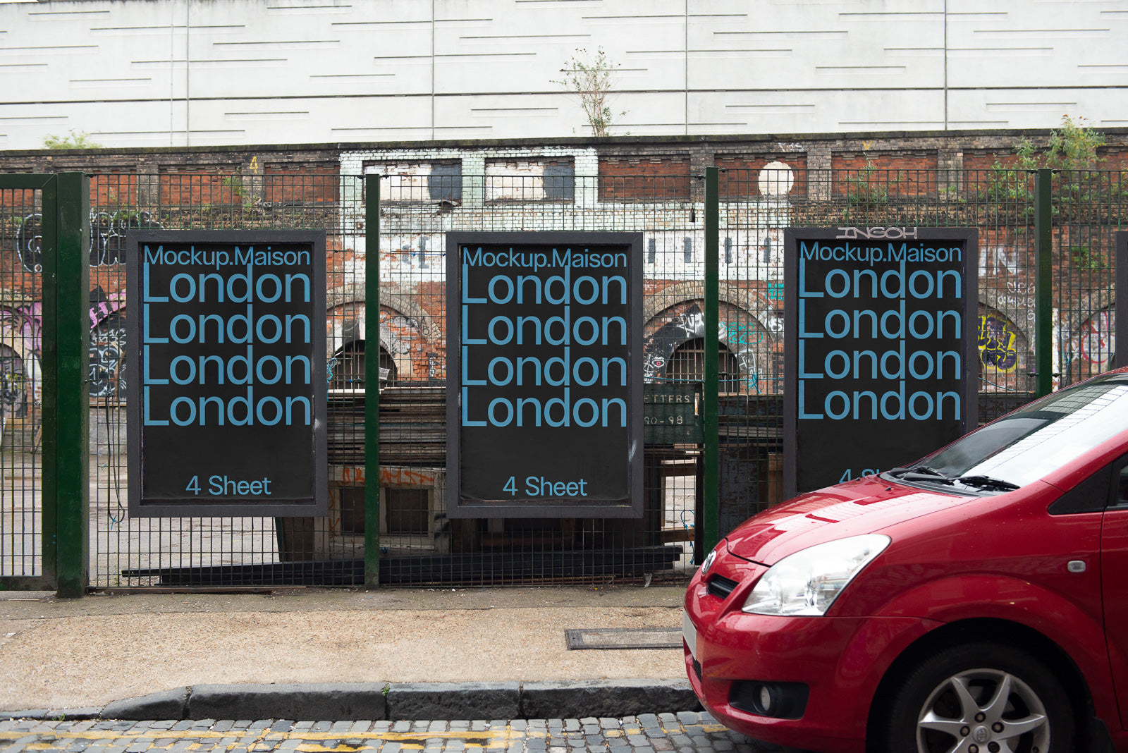 PSD mockup of three identical posters on a wire fence, displaying "Mockup.Maison London" text, next to a red car, with an urban backdrop.