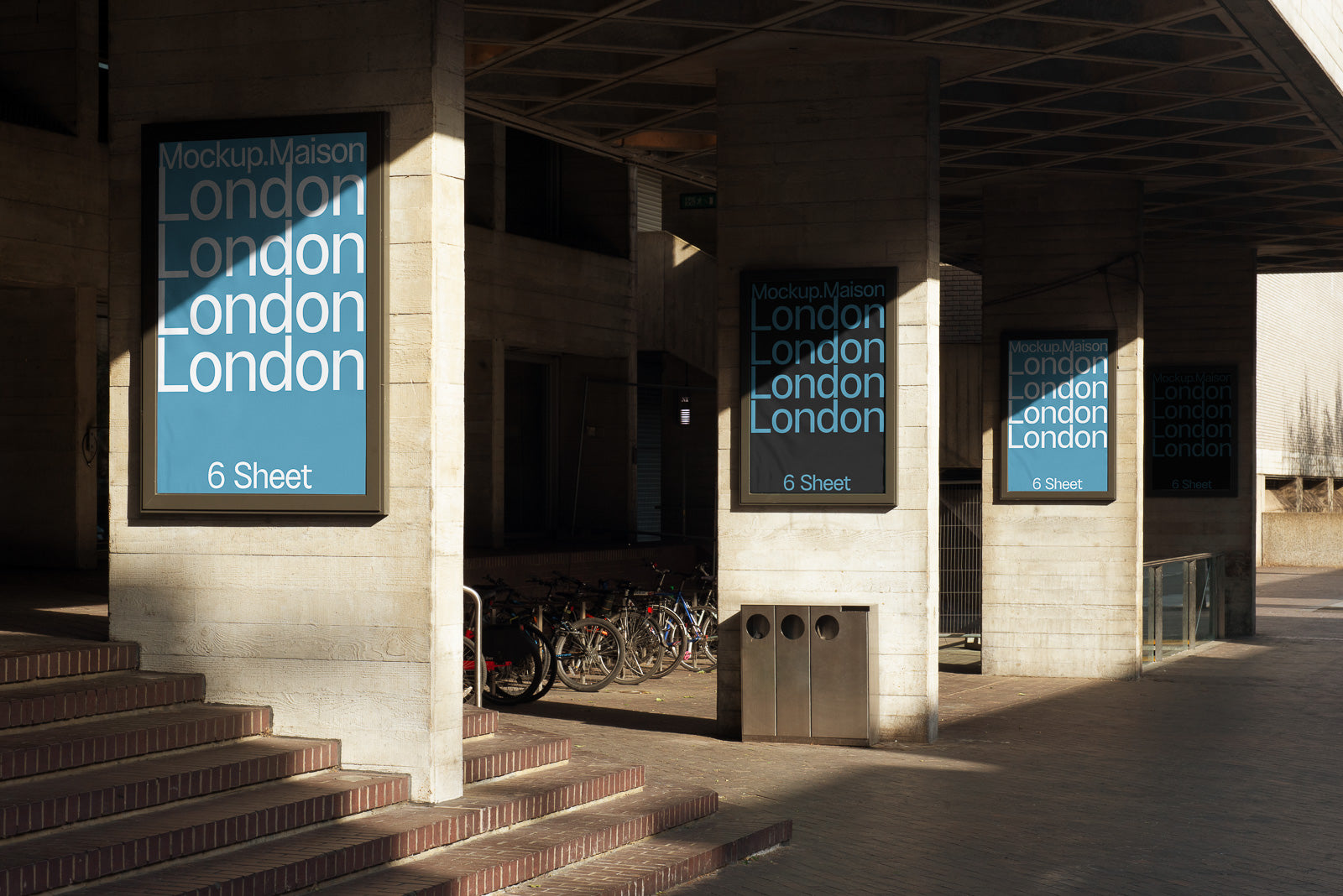 PSD mockup of three vertical advertising posters displayed on a building facade with blue backgrounds and white text reading "London."