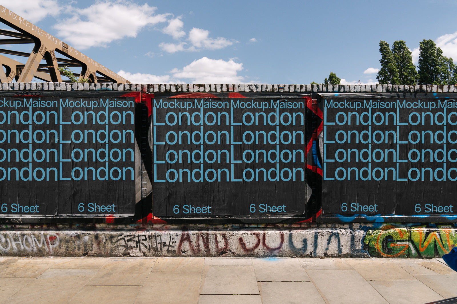 PSD mockup of a series of posters on a brick wall, featuring repeated text "London" in bold blue letters against a black background, with graffiti below.