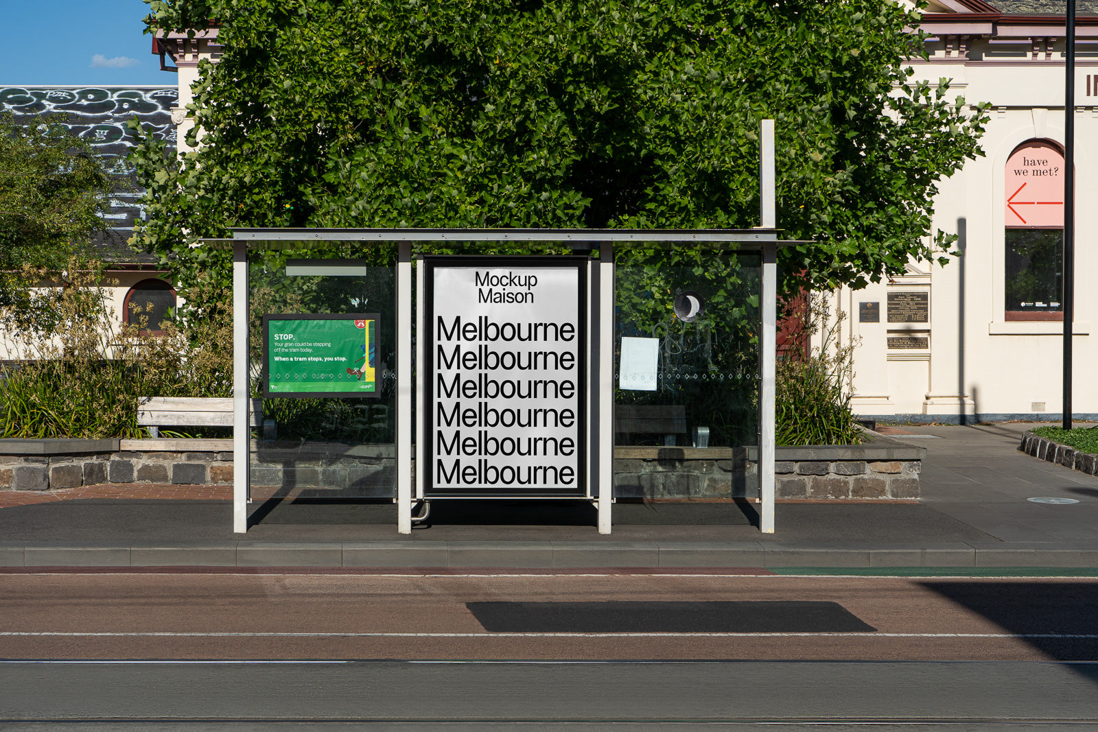 PSD mockup of a bus stop display in an urban setting featuring repeated text "Melbourne" in bold typography.