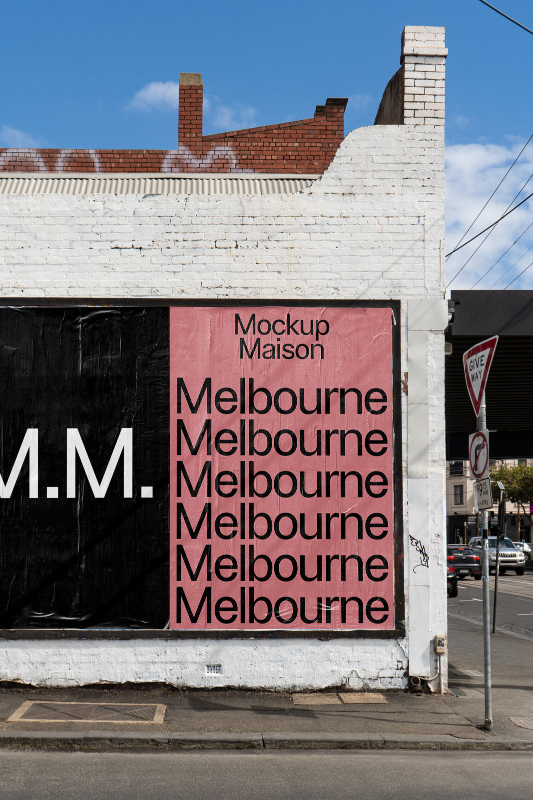 PSD mockup of a street wall poster with "Melbourne" repeated in bold black letters on a pink background next to a large "M.M."