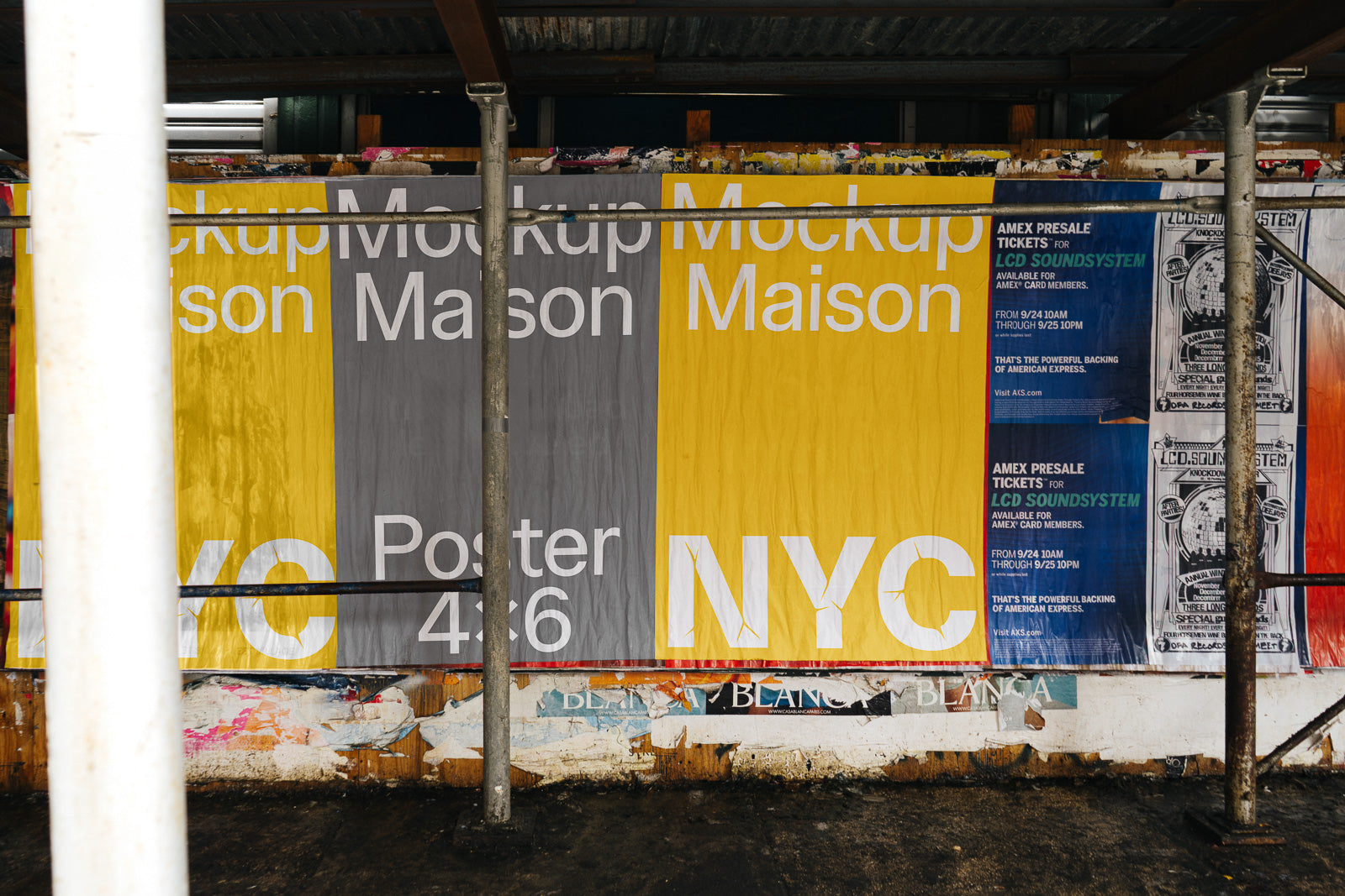 PSD mockup of an outdoor urban street poster with yellow and gray sections, displaying "Maison Mockup" and "NYC" in bold white text amidst a gritty, weathered background.