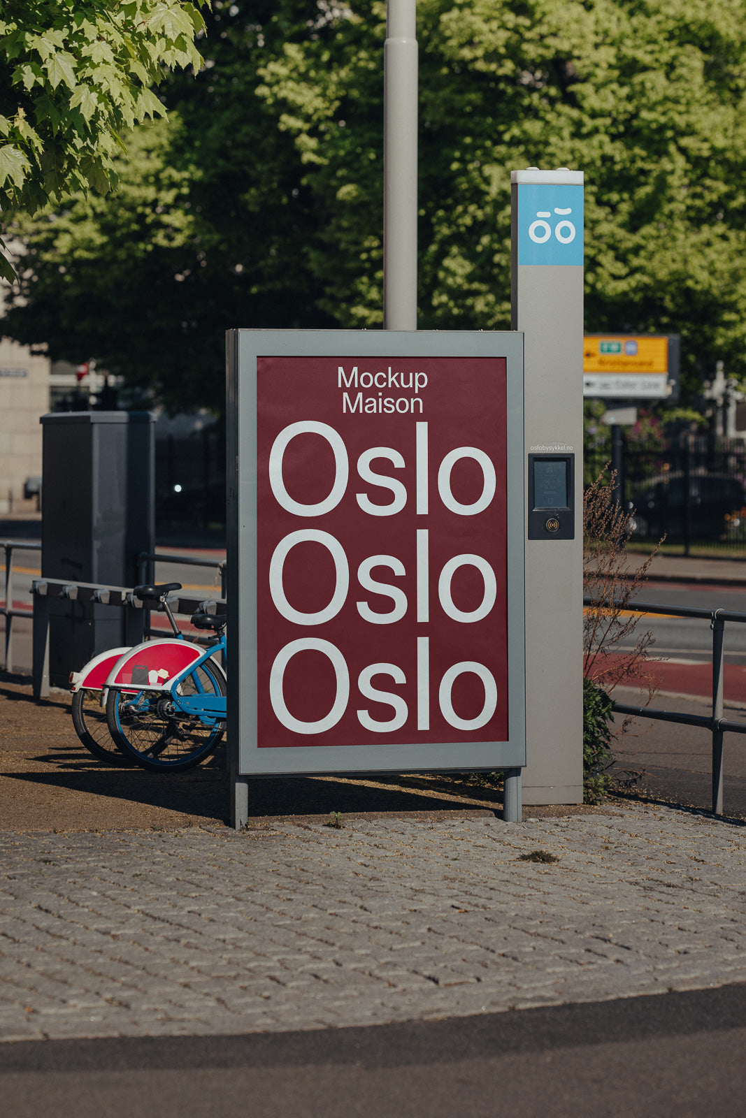 PSD mockup of a city street sign featuring repeated text "Oslo" against a dark red background, framed by a metal structure with a bicycle nearby.