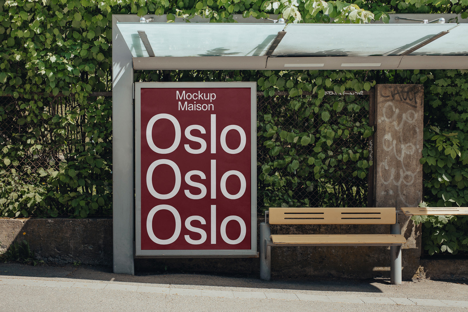 PSD mockup of a bus stop shelter with a maroon advertisement showcasing the word "Oslo" repeated in white text on the poster.