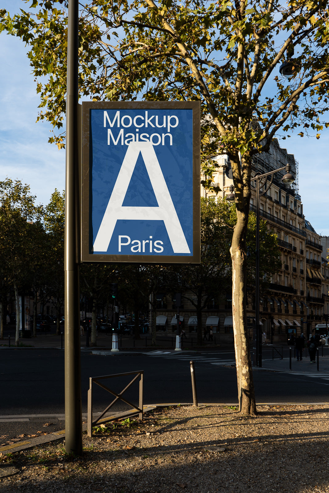 PSD mockup of a street sign with "Mockup Maison A Paris" text, set against an urban background with trees and buildings.