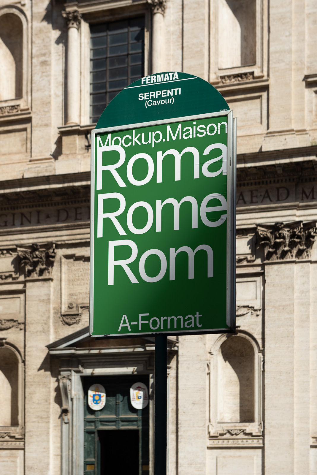 PSD mockup of a green bus stop sign with the text “Roma,” “Rome,” “Rom” and location details, set against a historic European architectural backdrop.