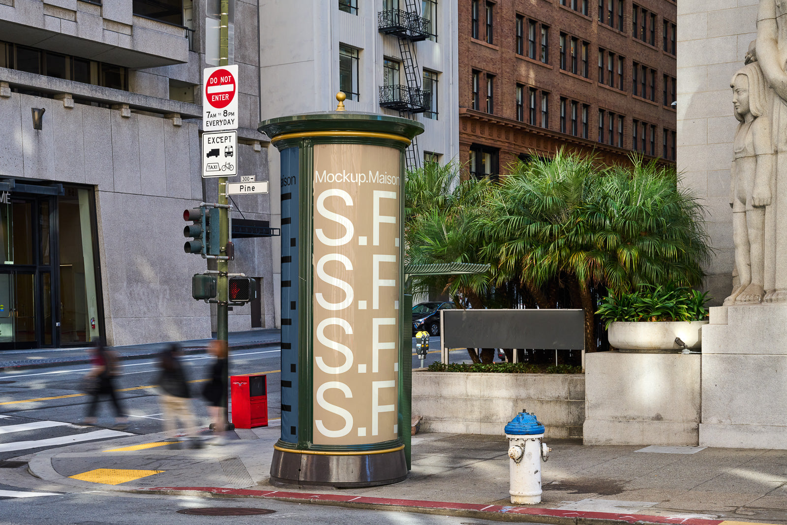 PSD mockup of a city street scene featuring a cylindrical advertisement kiosk with "S.F." repeated vertically, surrounded by urban buildings and greenery.