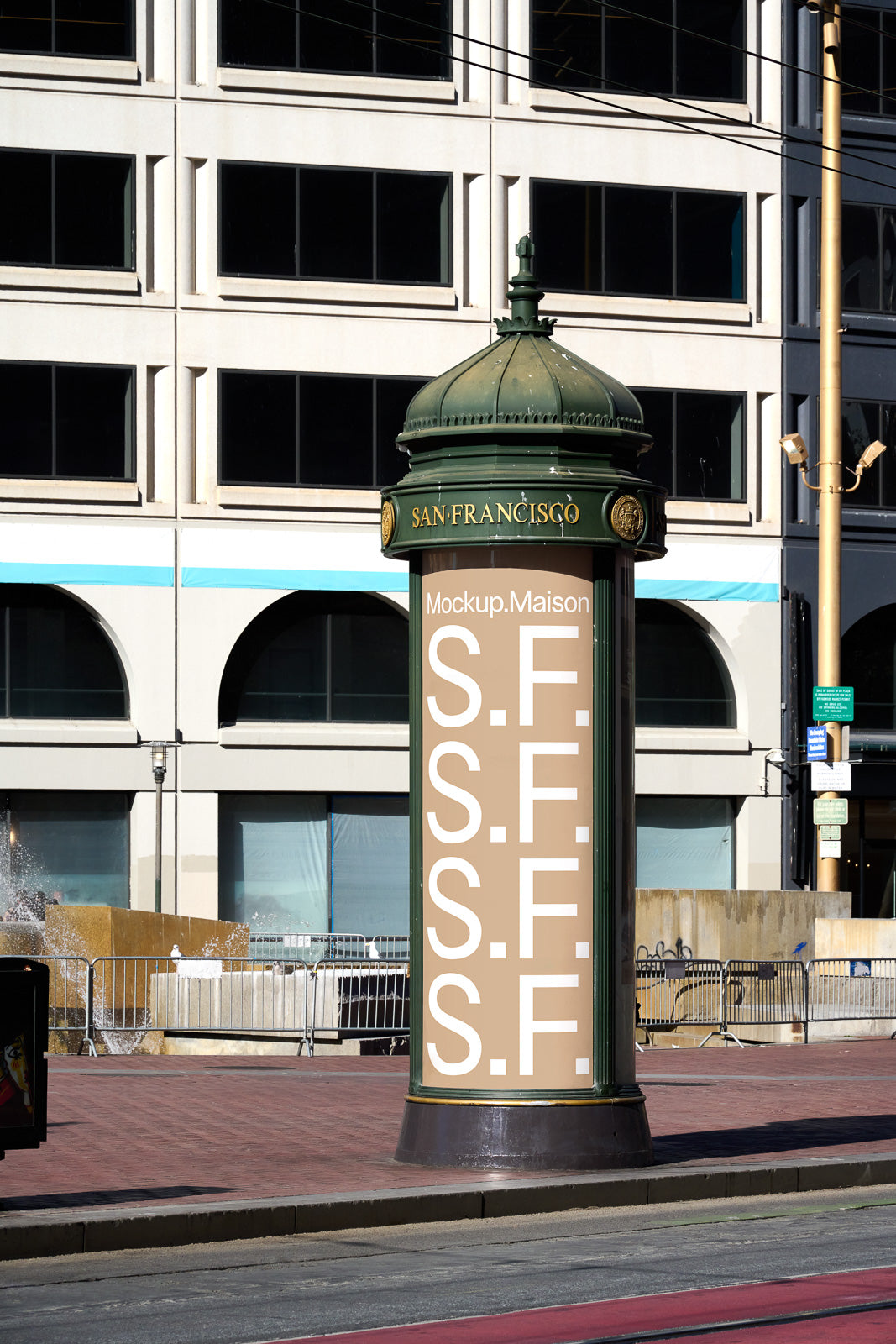 PSD mockup of a vintage San Francisco advertising column with customizable space displaying the text "S.F." against an urban background.